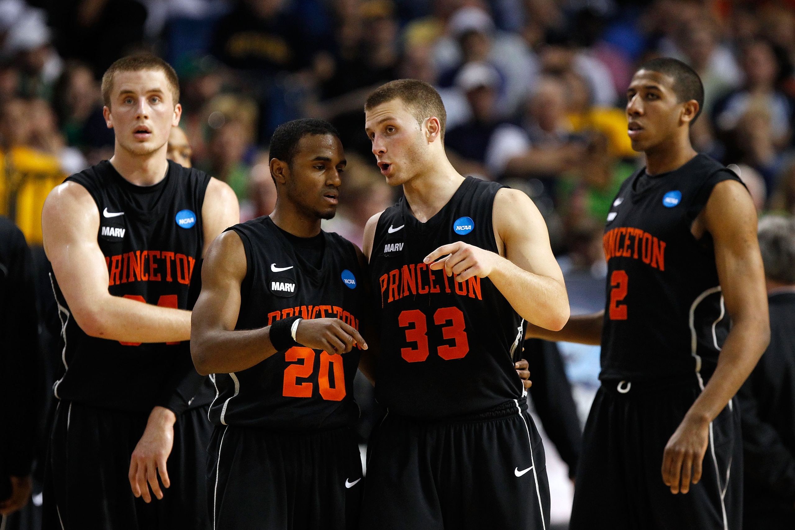 TAMPA, FL - MARCH 17:  (L-R) Ian Hummer #34, Douglas Davis #20, Dan Mavraides #33 and Kareem Maddox #2 of the Princeton Tigers look on against the Kentucky Wildcats during the second round of the 2011 NCAA men's basketball tournament at St. Pete Times For