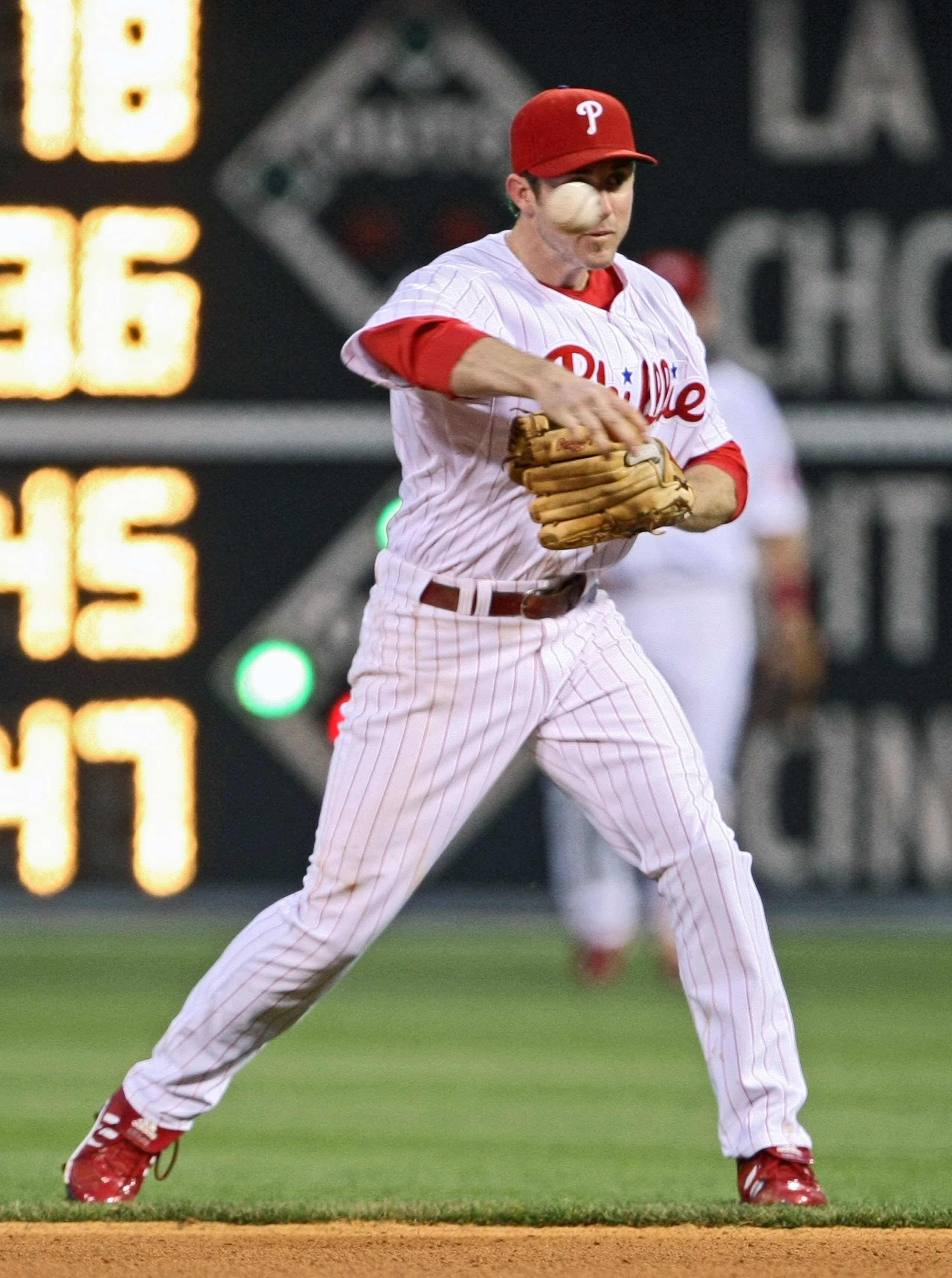 PHILADELPHIA - MAY 27: Chase Utley #26 of the Philadelphia Phillies throws the ball to first base during the game against the Colorado Rockies at Citizens Bank Park May 27, 2008 in Philadelphia, Pennsylvania. (Photo by Drew Hallowell/Getty Images)