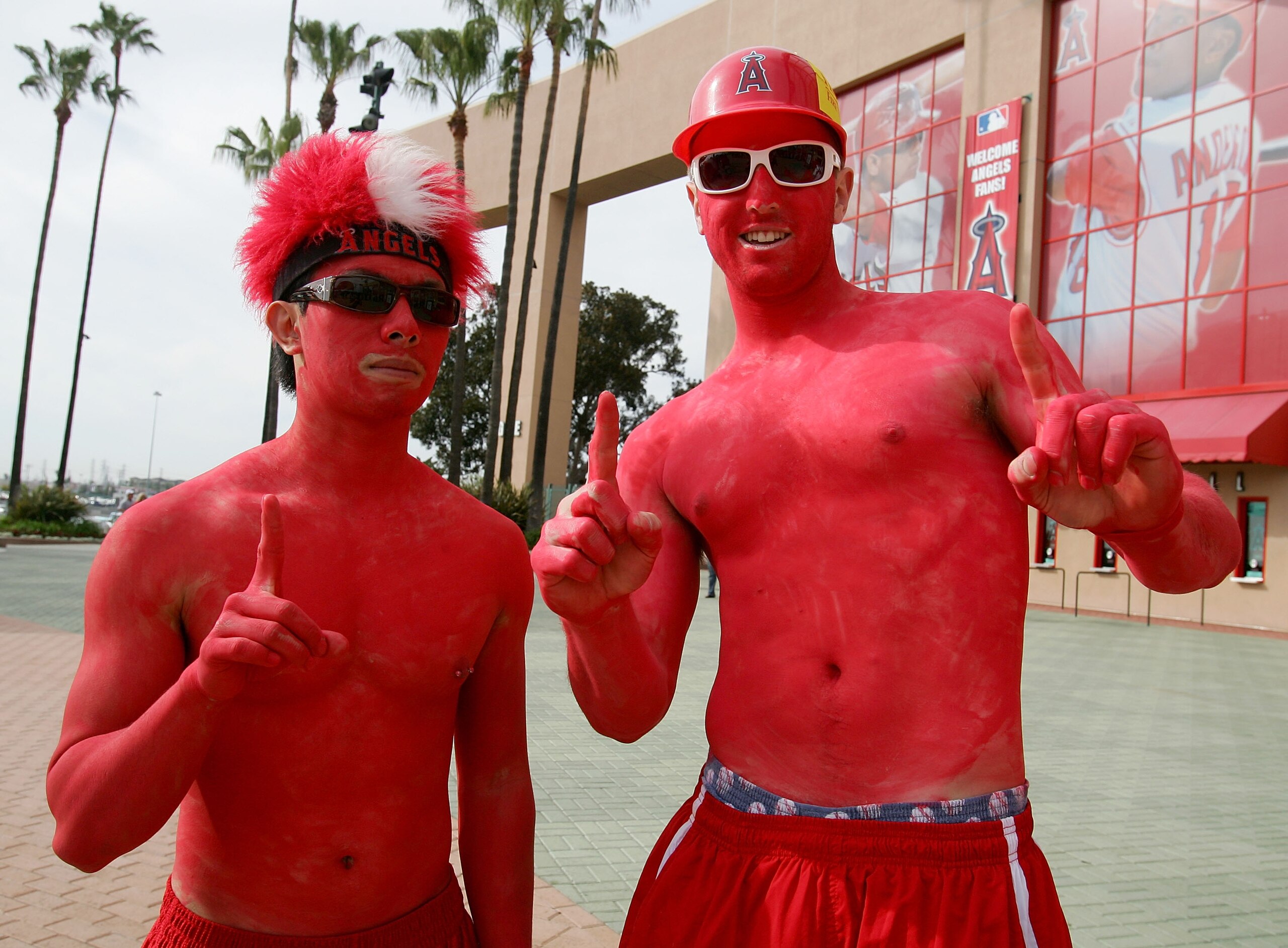 ANAHEIM, CA - APRIL 02:  Puilok Choi (L) and Aaron Jenkins of Riverside, fans of the Los Angeles Angels of Anaheim pose for photos before the Angels Home Opener against the Texas Rangers on April 2, 2007 at Angel Stadium in Anaheim, California.  (Photo by