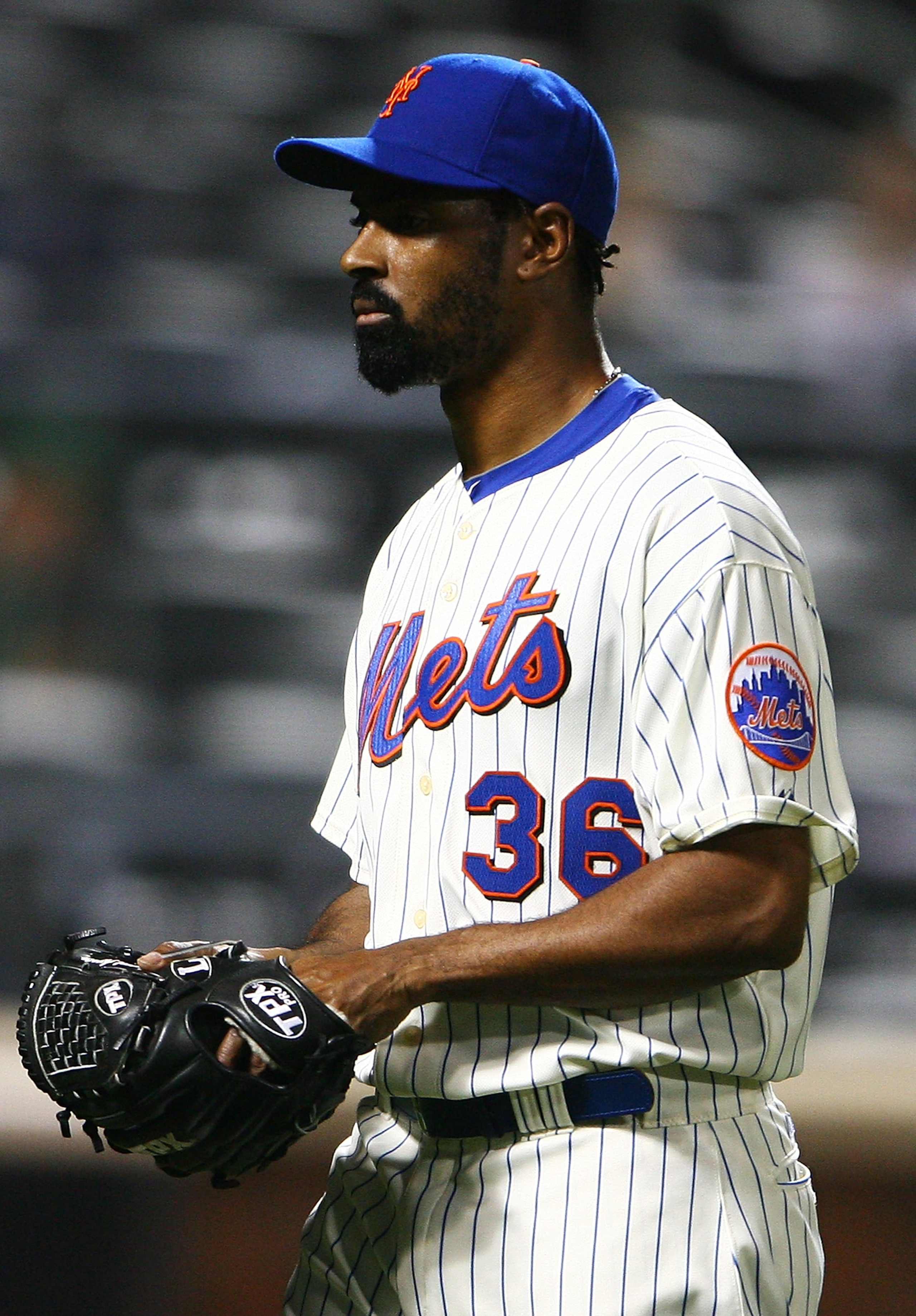 NEW YORK - SEPTEMBER 30: Manny Acosta #36 of the New York Mets walks off the field in the ninth inning during a game against the Milwaukee Brewers on September 30, 2010 at Citi Field in the Flushing neighborhood of the Queens borough of New York City. Th NEW YORK - SEPTEMBER 30: Manny Acosta #36 of the New York Mets walks off the field in the ninth inning during a game against the Milwaukee Brewers on September 30, 2010 at Citi Field in the Flushing neighborhood of the Queens borough of New York City. Th