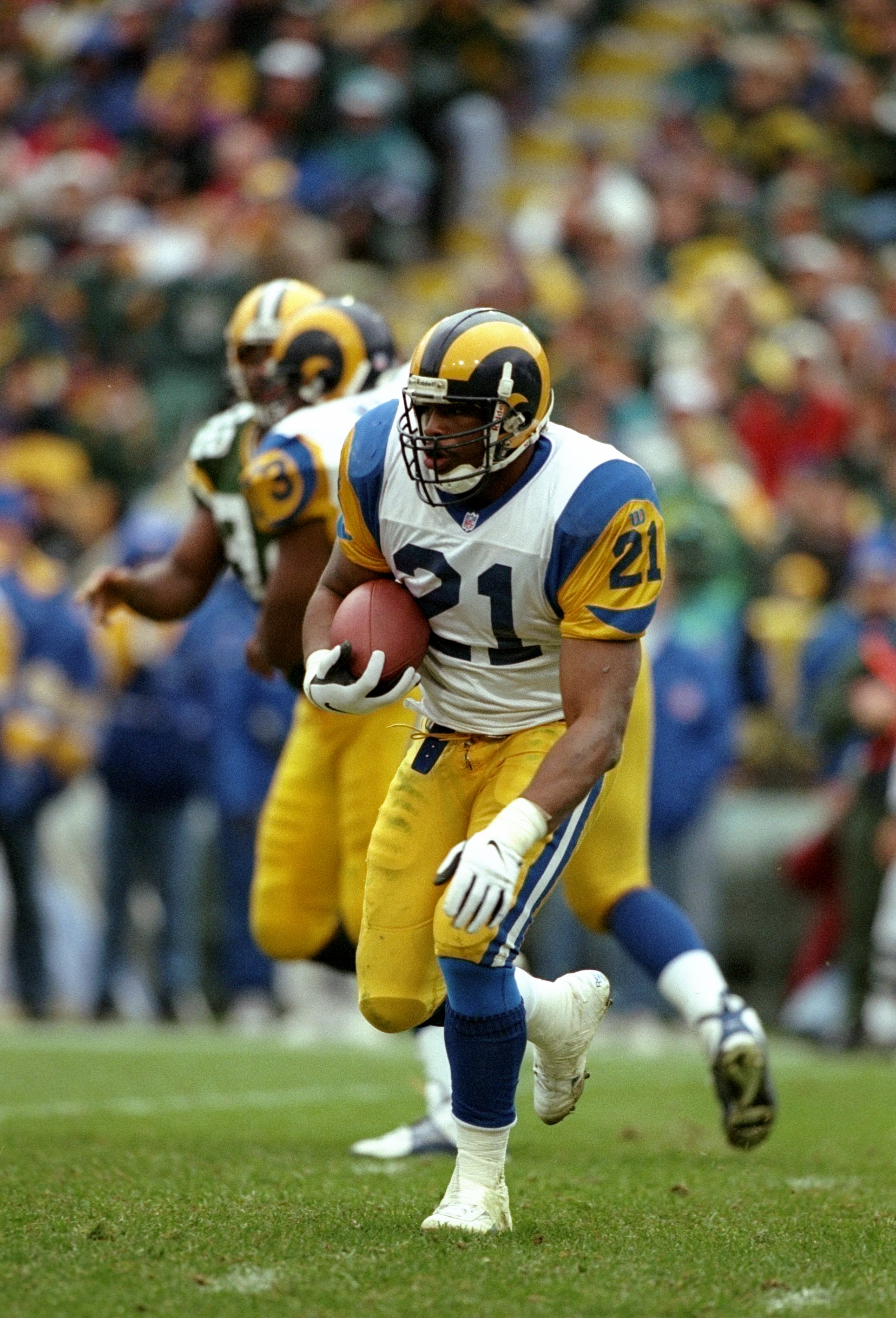 9 Nov 1997:  Running back Lawrence Phillips of the St. Louis Rams runs with the ball during a game against the Green Bay Packers at Lambeau Field in Green Bay, Wisconsin.  The Packers won the game 17-7. Mandatory Credit: Jonathan Daniel  /Allsport