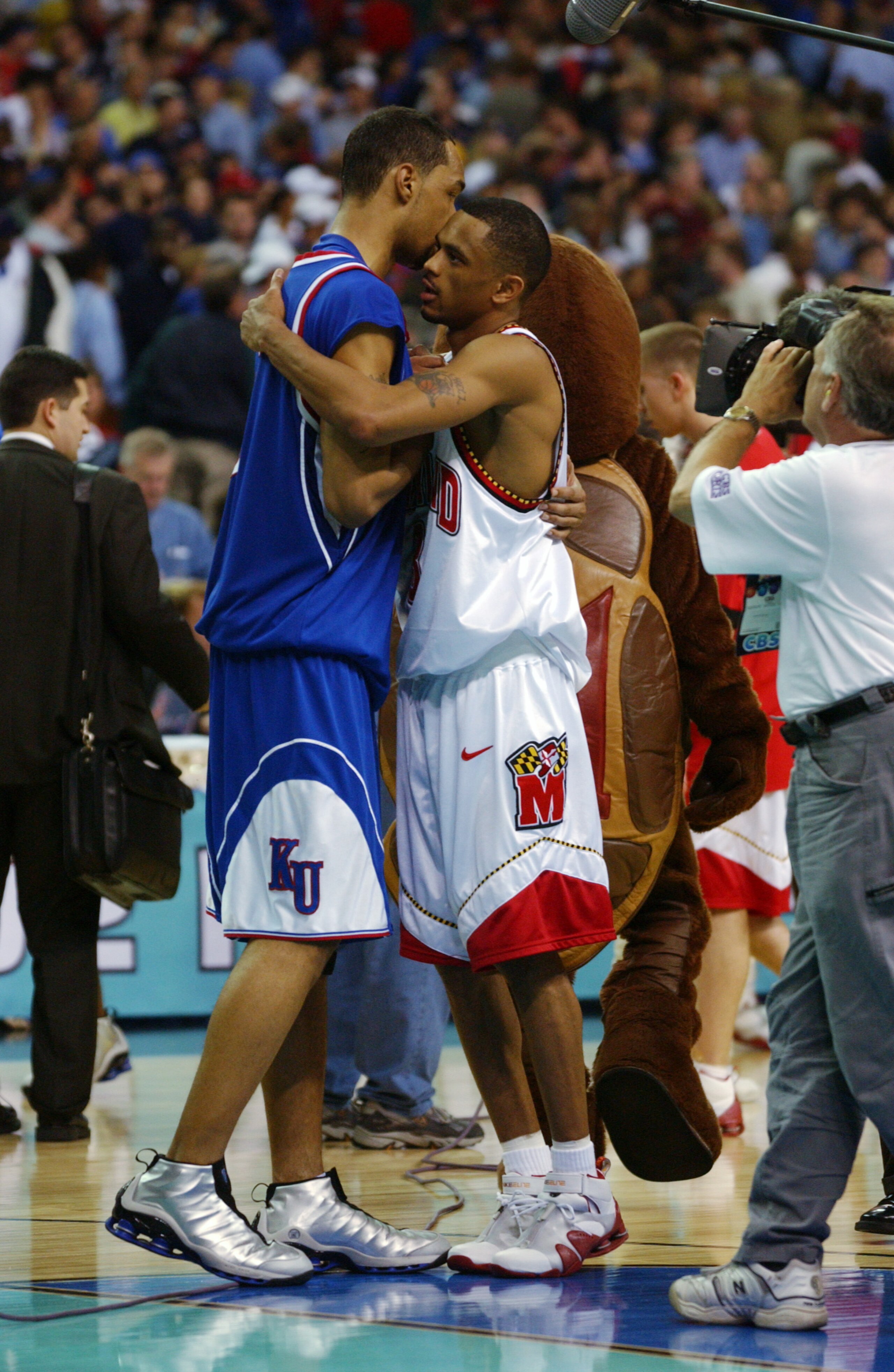 30 Mar 2002:  Juan Dixon #3 of Maryland greets Drew Gooden #0 of Kansas after the semifinal round of the NCAA Men's Final Four at the Georgia Dome in Atlanta, Georgia.  Maryland defeated Kansas 97-88, advancing them to the championship game. DIGITAL IMAGE