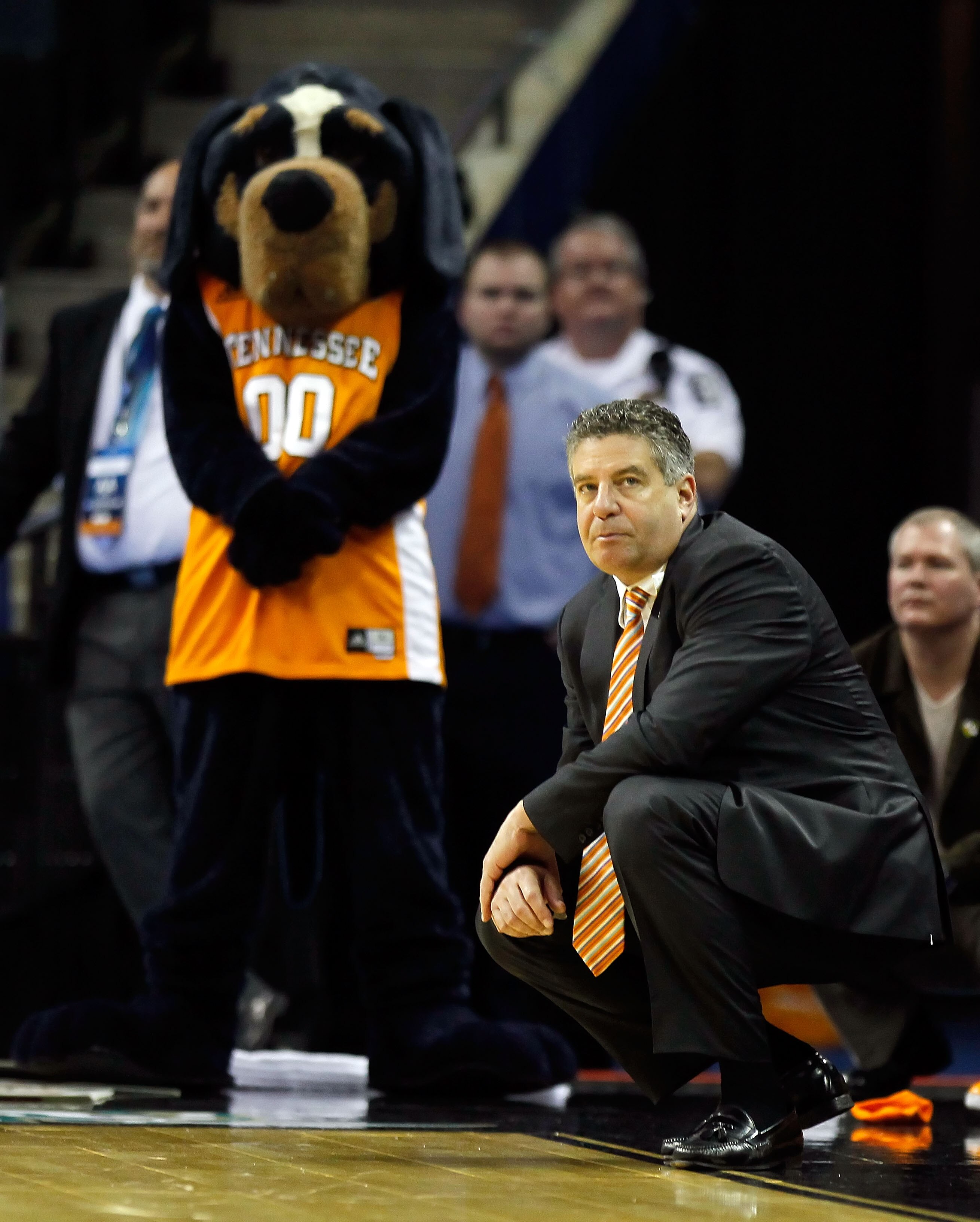 CHARLOTTE, NC - MARCH 18:  Head coach Bruce Pearl of the Tennessee Volunteers kneels down on the sideline before the Volunteers were defeated 75-45 by the Michigan Wolverines during the second round of the 2011 NCAA men's basketball tournament at Time War