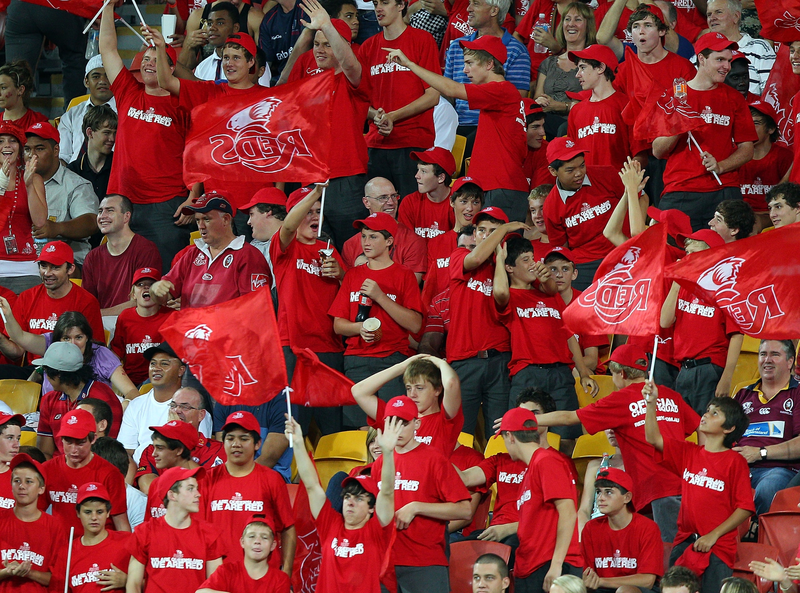 BRISBANE, AUSTRALIA - MARCH 18:  Reds fans celebrate winning the round five Super Rugby match between the Reds and the Melbourne Rebels on March 18, 2011 in Brisbane, Australia.  (Photo by Chris Hyde/Getty Images)
