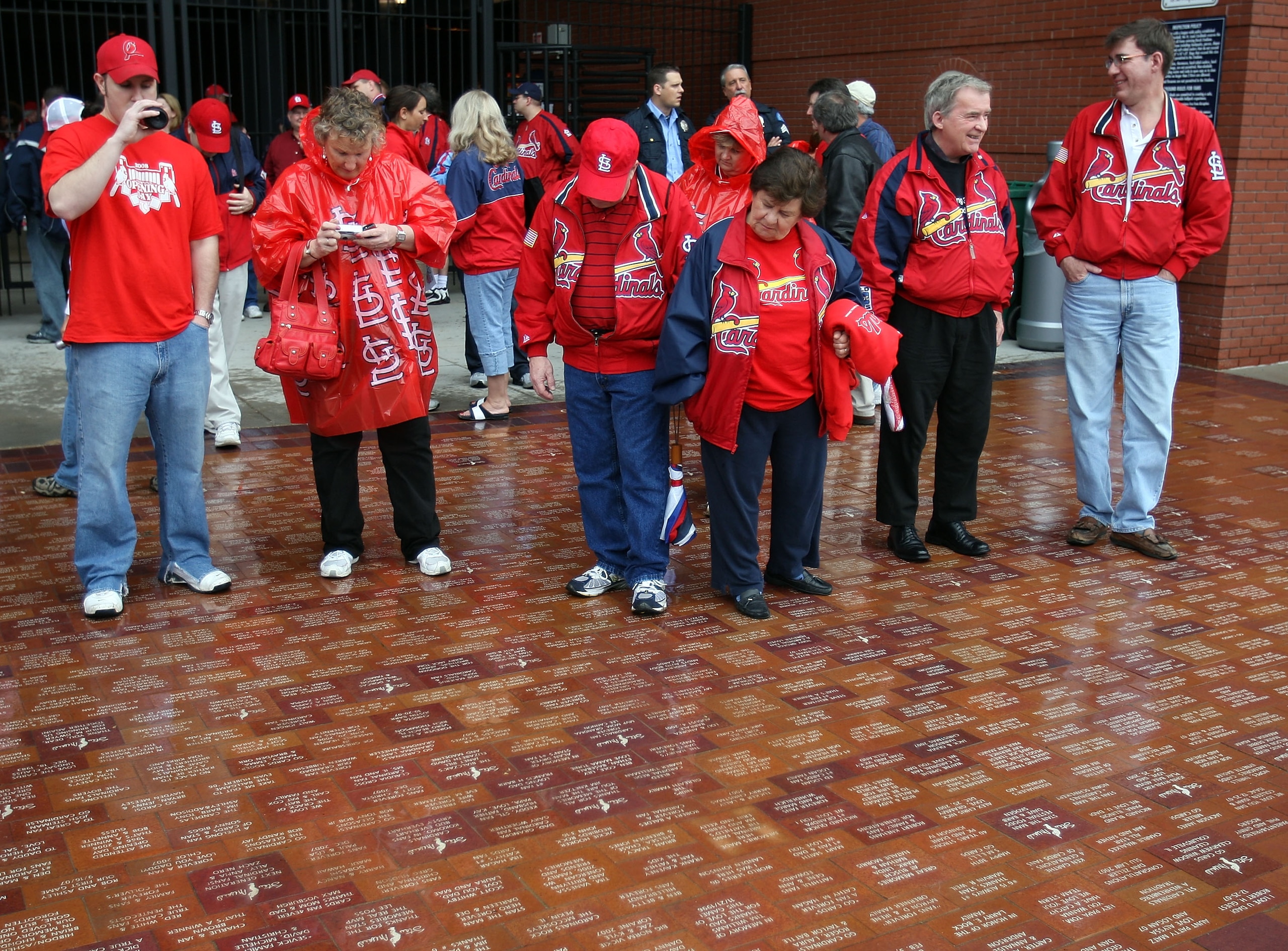 ST. LOUIS - MARCH 31:  St. Louis Cardinal fans read the walkway outside of Busch Stadium on opening day against the Colorado Rockies March 31, 2008 in St. Louis, Missouri.  (Photo by Elsa/Getty Images)