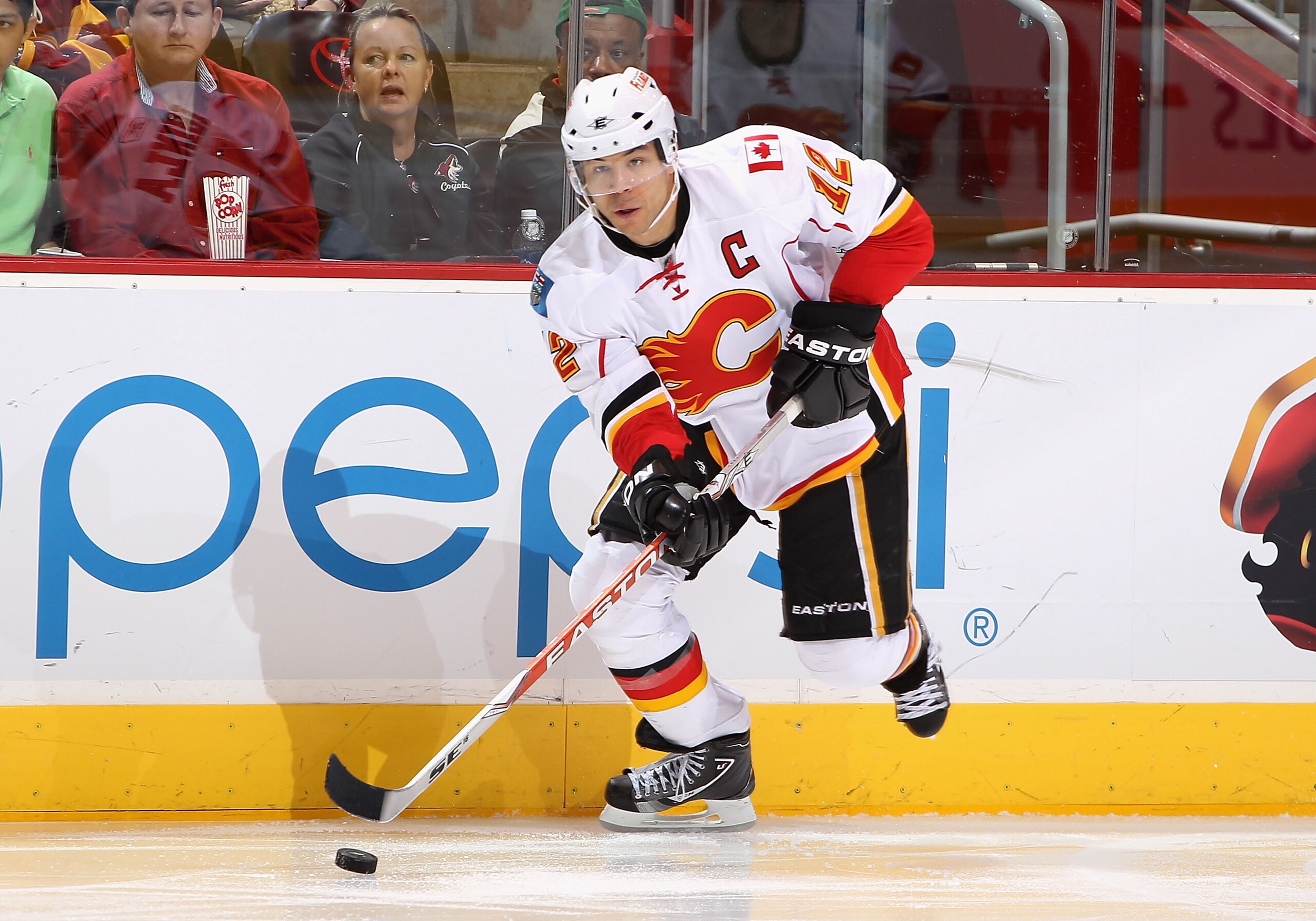 GLENDALE, AZ - MARCH 10:  Jarome Iginla #12 of the Calgary Flames skates with the puck during the NHL game against the Phoenix Coyotes at Jobing.com Arena on March 10, 2011 in Glendale, Arizona.  The Coyotes defeated the Flames 3-0.  (Photo by Christian P