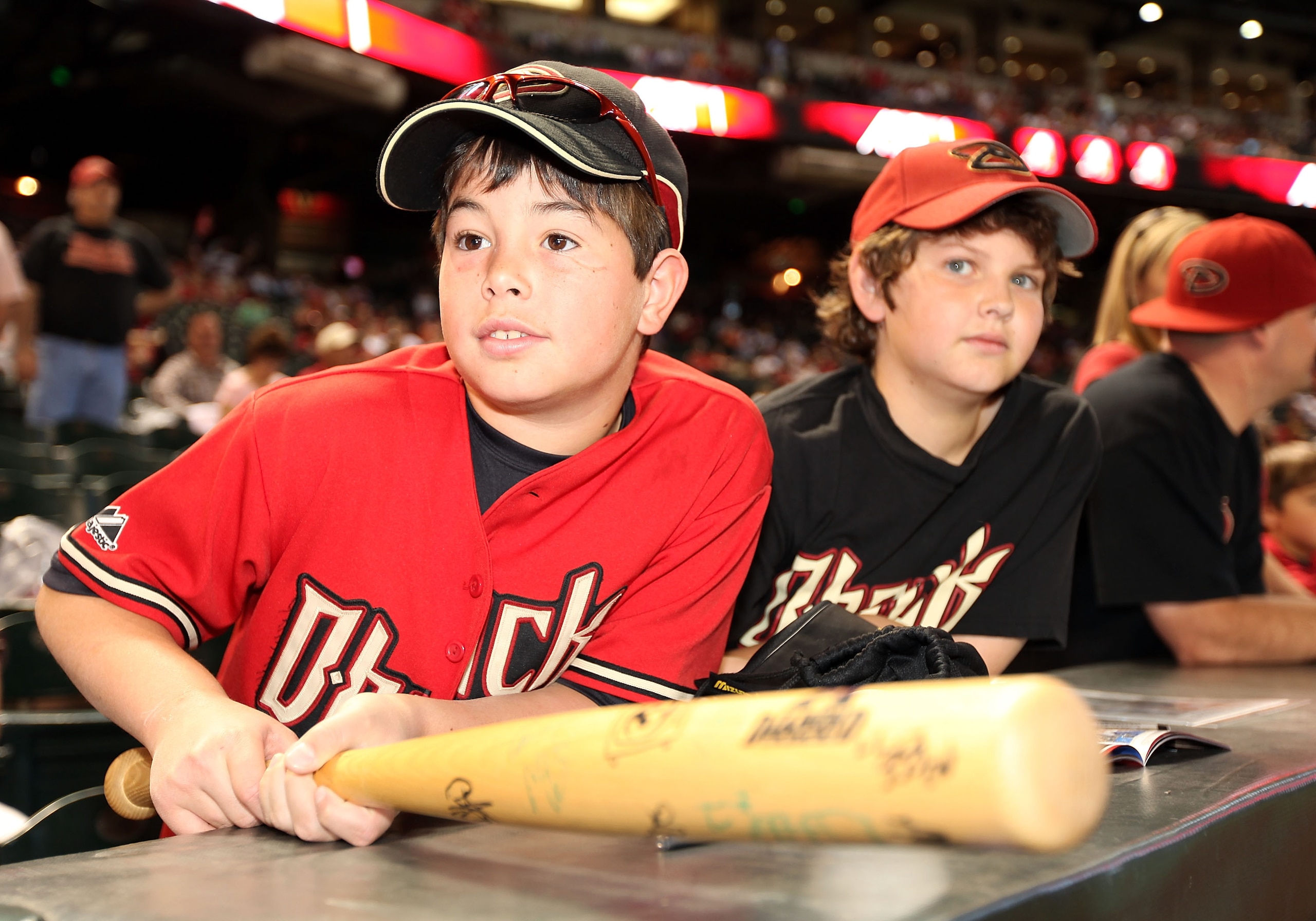 PHOENIX - APRIL 06:  A young fan of the Arizona Diamondbacks looks on during the MLB openning day game against the Colorado Rockies at Chase Field on April 6, 2009 in Phoenix, Arizona.  The Diamondbacks defeated the Rockies 9-8.   (Photo by Christian Pete