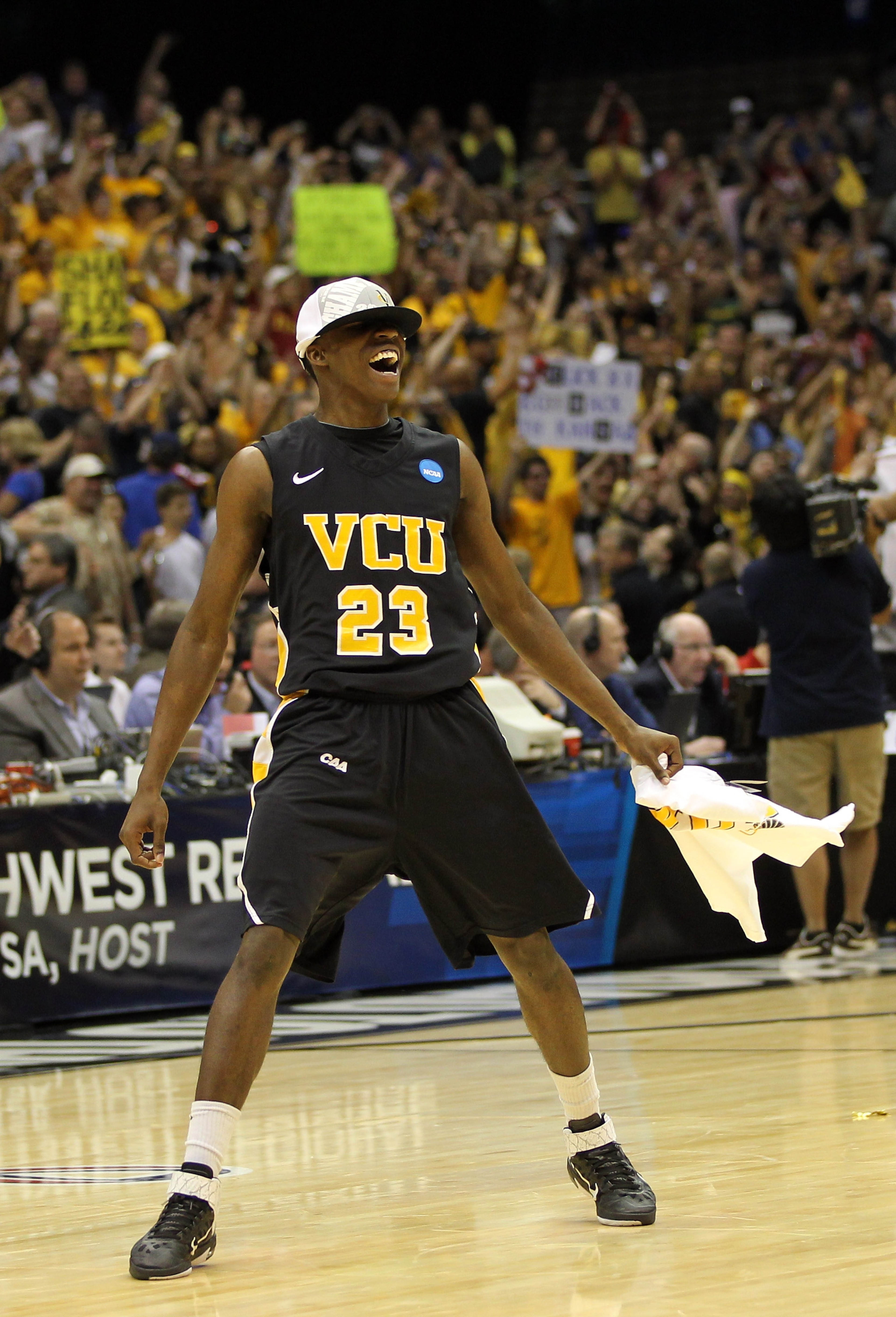 SAN ANTONIO, TX - MARCH 27:  Rob Brandenberg #23 of the Virginia Commonwealth Rams celebrates after defeating the Kansas Jayhawks during the southwest regional final of the 2011 NCAA men's basketball tournament at the Alamodome on March 27, 2011 in San An