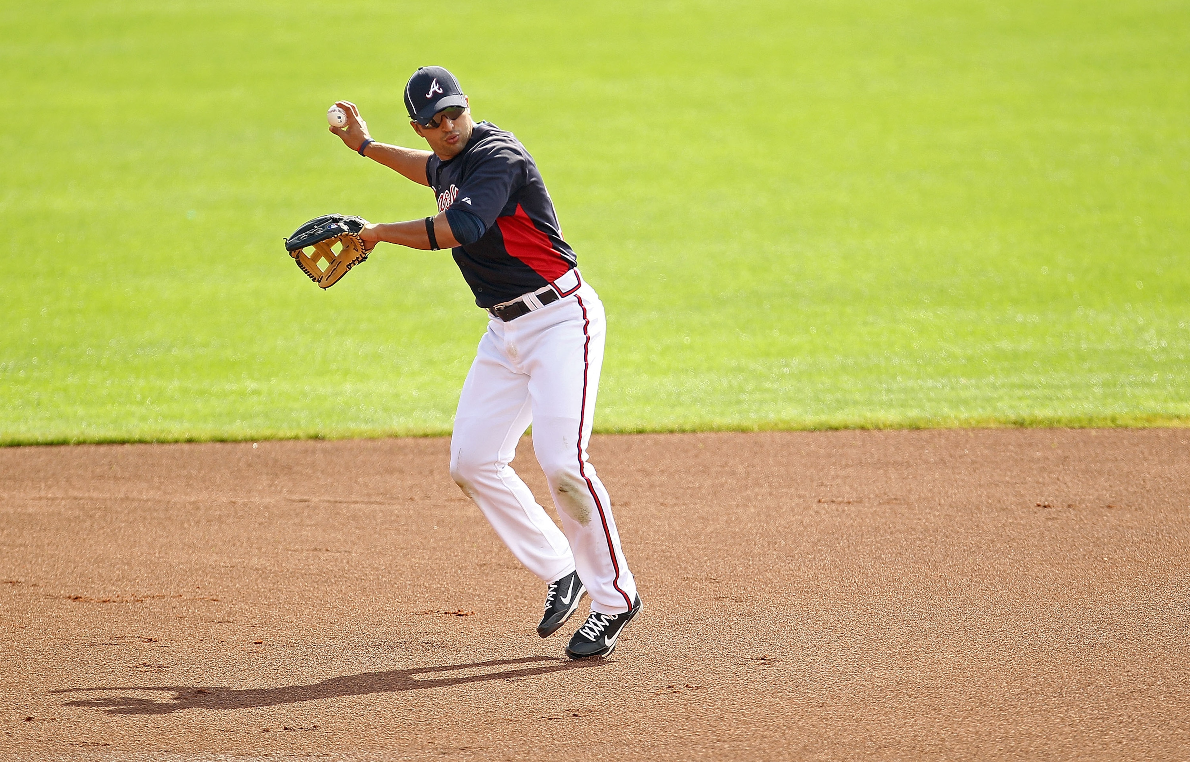 LAKE BUENA VISTA, FL - FEBRUARY 21: Martin Prado #14 of the Atlanta Braves fields ground balls during a spring training workout at Champion Stadium on February 21, 2011 in Lake Buena Vista, Florida. (Photo by Mike Ehrmann/Getty Images) LAKE BUENA VISTA, FL - FEBRUARY 21: Martin Prado #14 of the Atlanta Braves fields ground balls during a spring training workout at Champion Stadium on February 21, 2011 in Lake Buena Vista, Florida. (Photo by Mike Ehrmann/Getty Images)