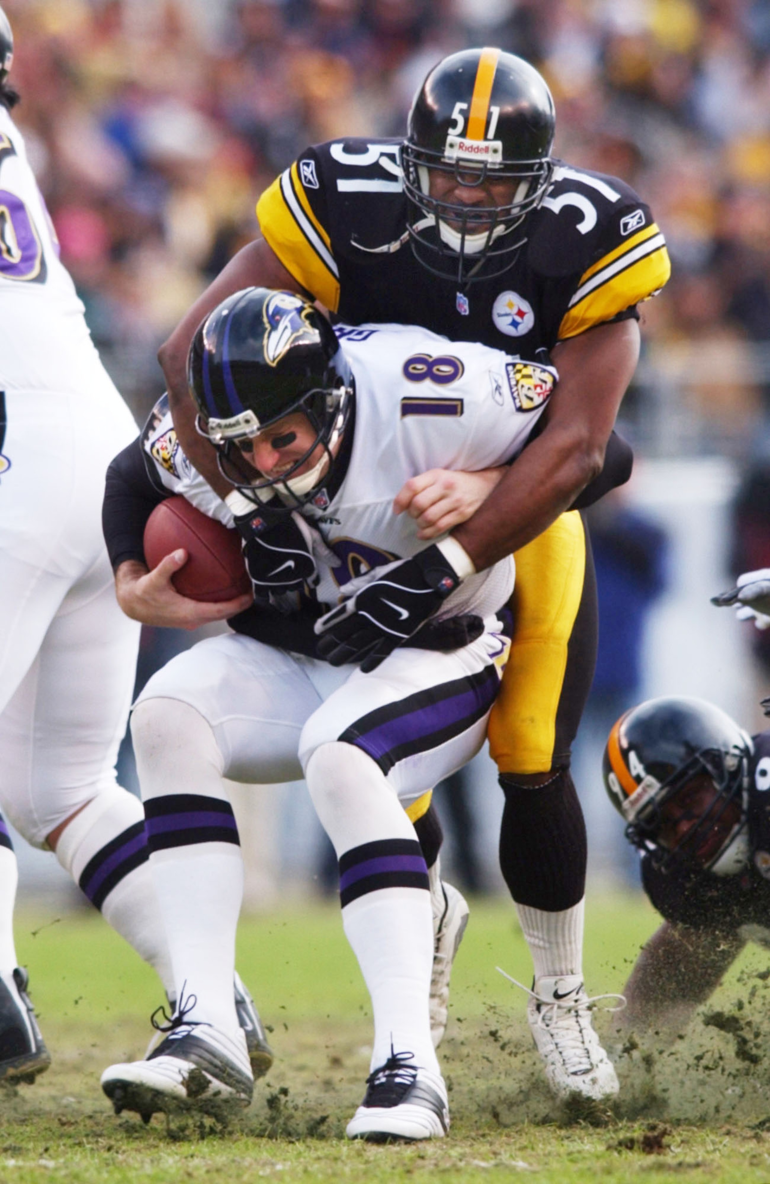 20 Jan 2002: Mike Jones #51 of the Pittsburgh Steelers collects a sack on Elvis Grbac #18 of the Baltimore Ravens in AFC Playoff action at Heinz Field in Pittsburgh, Pennsylvania. DIGITAL IMAGE. Mandatory Credit: Doug Pensinger/Getty Images 20 Jan 2002: Mike Jones #51 of the Pittsburgh Steelers collects a sack on Elvis Grbac #18 of the Baltimore Ravens in AFC Playoff action at Heinz Field in Pittsburgh, Pennsylvania. DIGITAL IMAGE. Mandatory Credit: Doug Pensinger/Getty Images