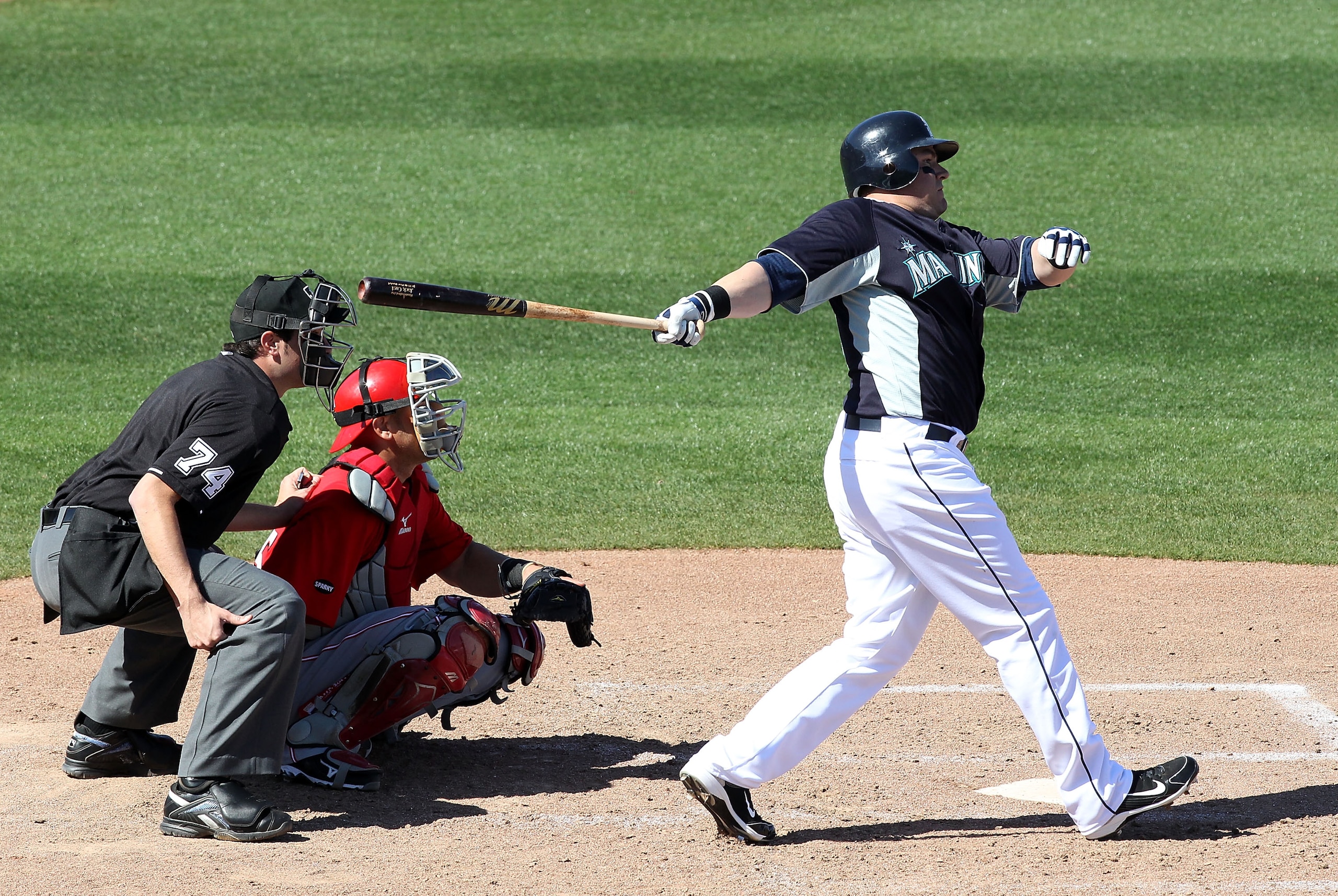 PEORIA, AZ - MARCH 04:  Jack Cust #29 of the Seattle Mariners hits a double against the Cincinnati Reds during the fourth inning of the spring training game at Peoria Stadium on March 4, 2011 in Peoria, Arizona.  (Photo by Christian Petersen/Getty Images)