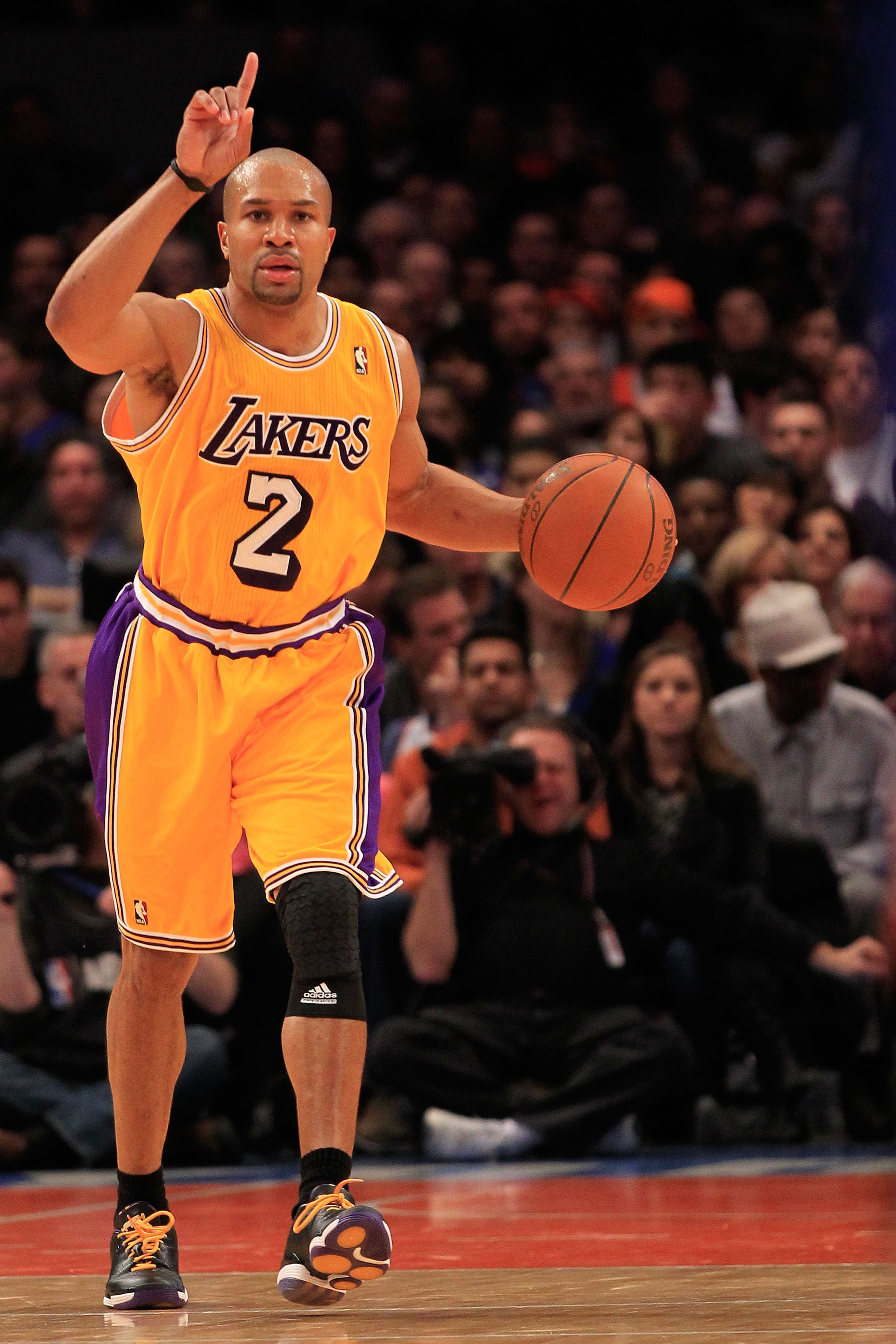 NEW YORK, NY - FEBRUARY 11: Derek Fisher #2 of the Los Angeles Lakers dribbles the ball against the New York Knicks at Madison Square Garden on February 11, 2011 in New York City. NOTE TO USER: User expressly acknowledges and agrees that, by downloading a