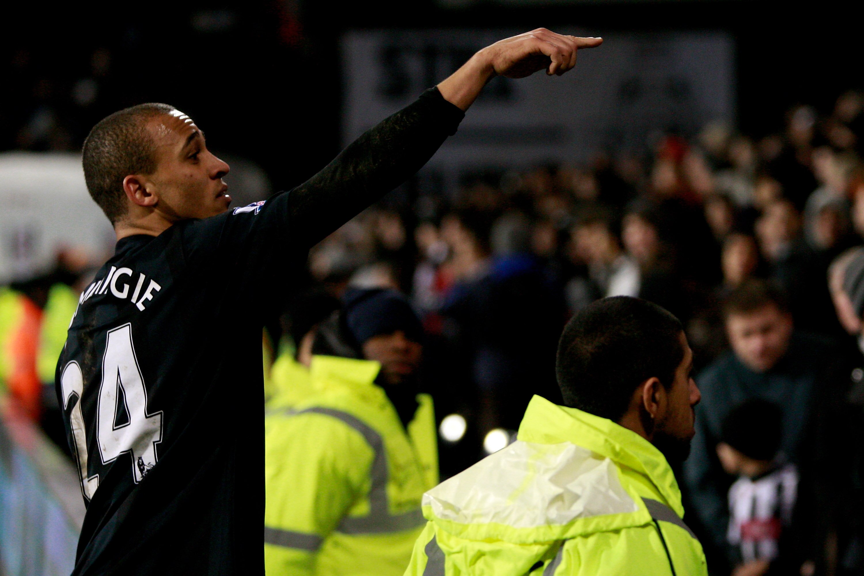 LONDON, ENGLAND - JANUARY 04:  Peter Odemwingie of West Brom seeks out a girl he hit on the head with a shot during practise, to give her his shirt after the Barclays Premier League match between Fulham and West Bromwich Albion at Craven Cottage on Januar