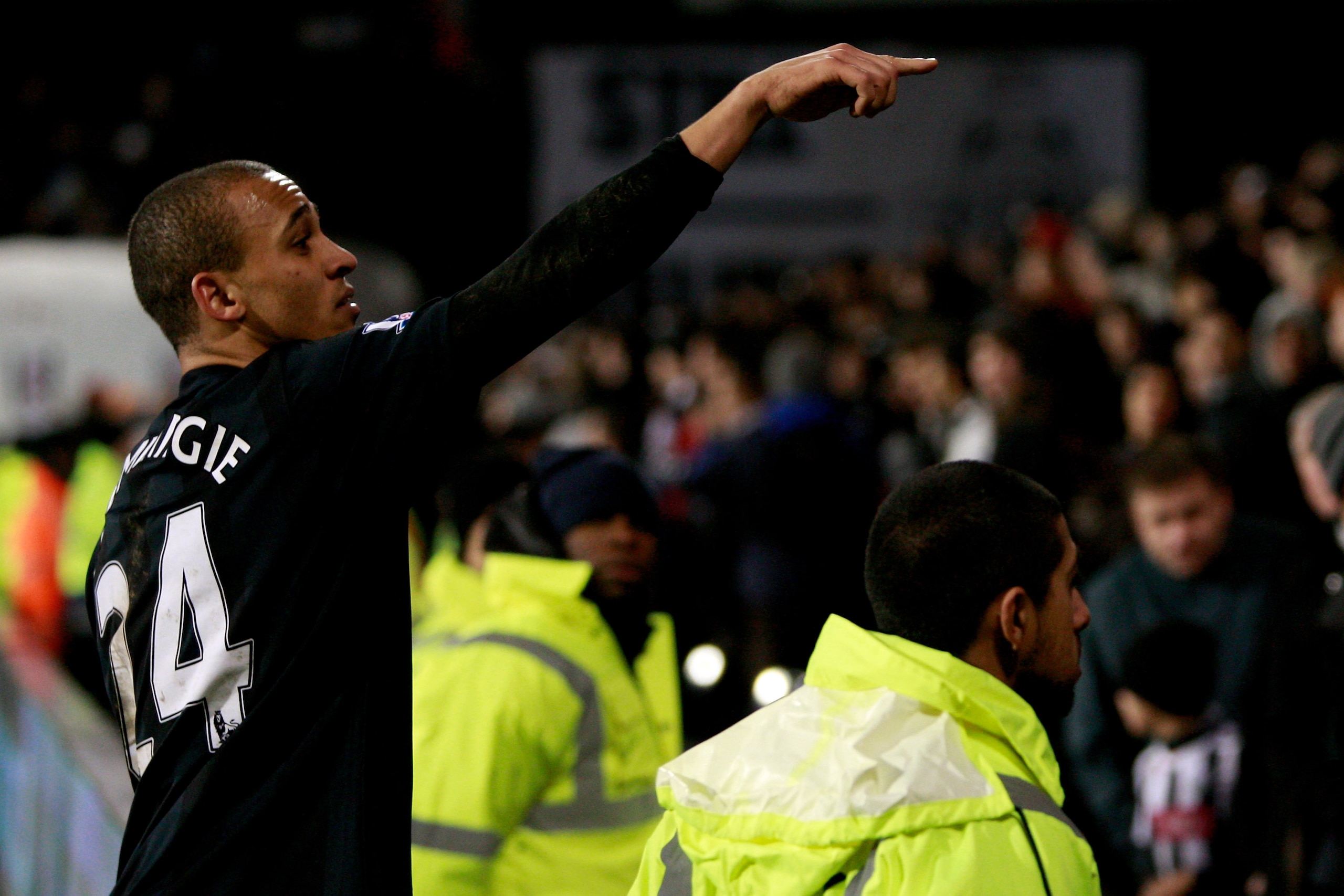LONDON, ENGLAND - JANUARY 04:  Peter Odemwingie of West Brom seeks out a girl he hit on the head with a shot during practise, to give her his shirt after the Barclays Premier League match between Fulham and West Bromwich Albion at Craven Cottage on Januar
