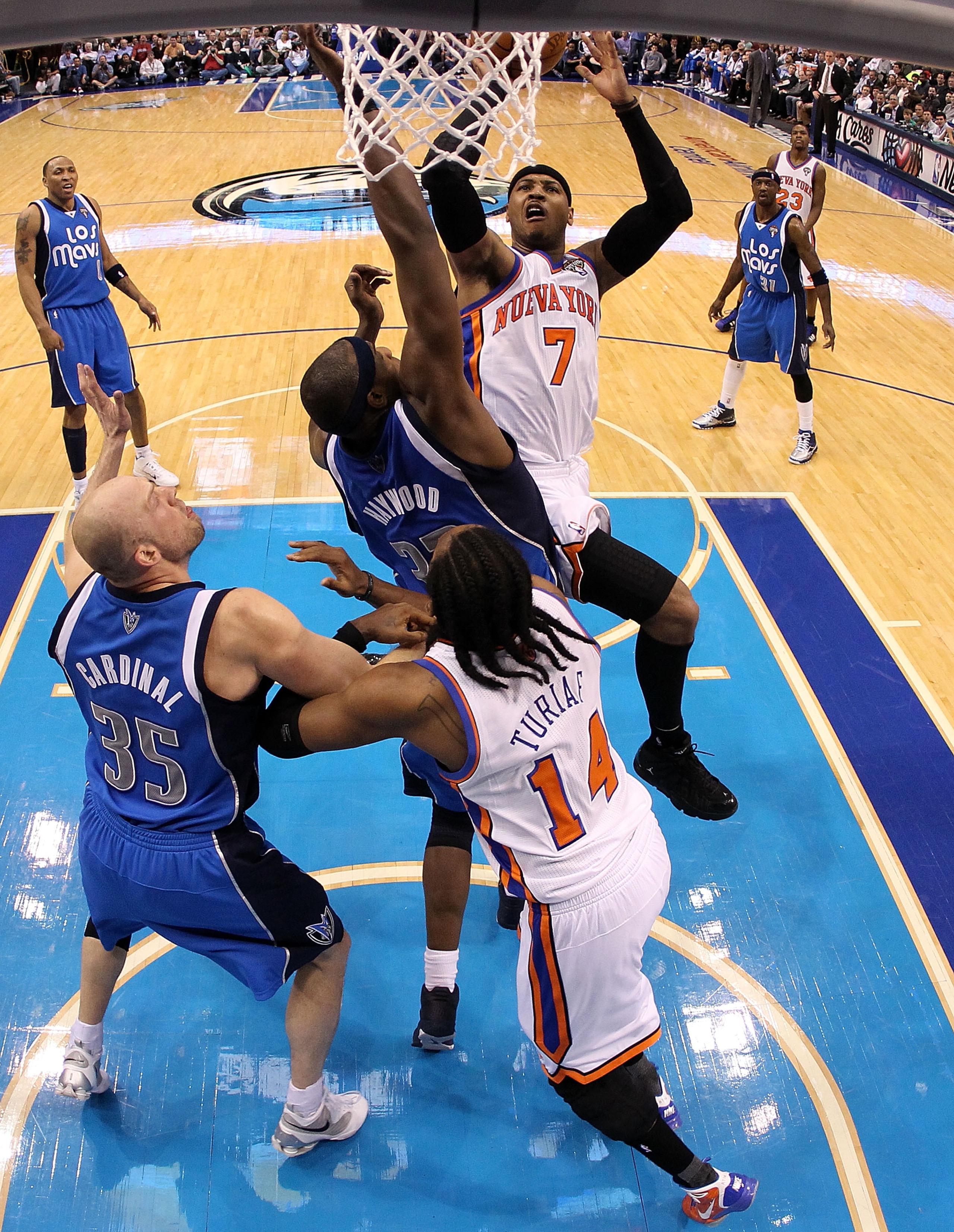 DALLAS, TX - MARCH 10:  Forward Carmelo Anthony #7 of the New York Knicks takes a shot against Brendan Haywood #7 of the Dallas Mavericks at American Airlines Center on March 10, 2011 in Dallas, Texas.  NOTE TO USER: User expressly acknowledges and agrees