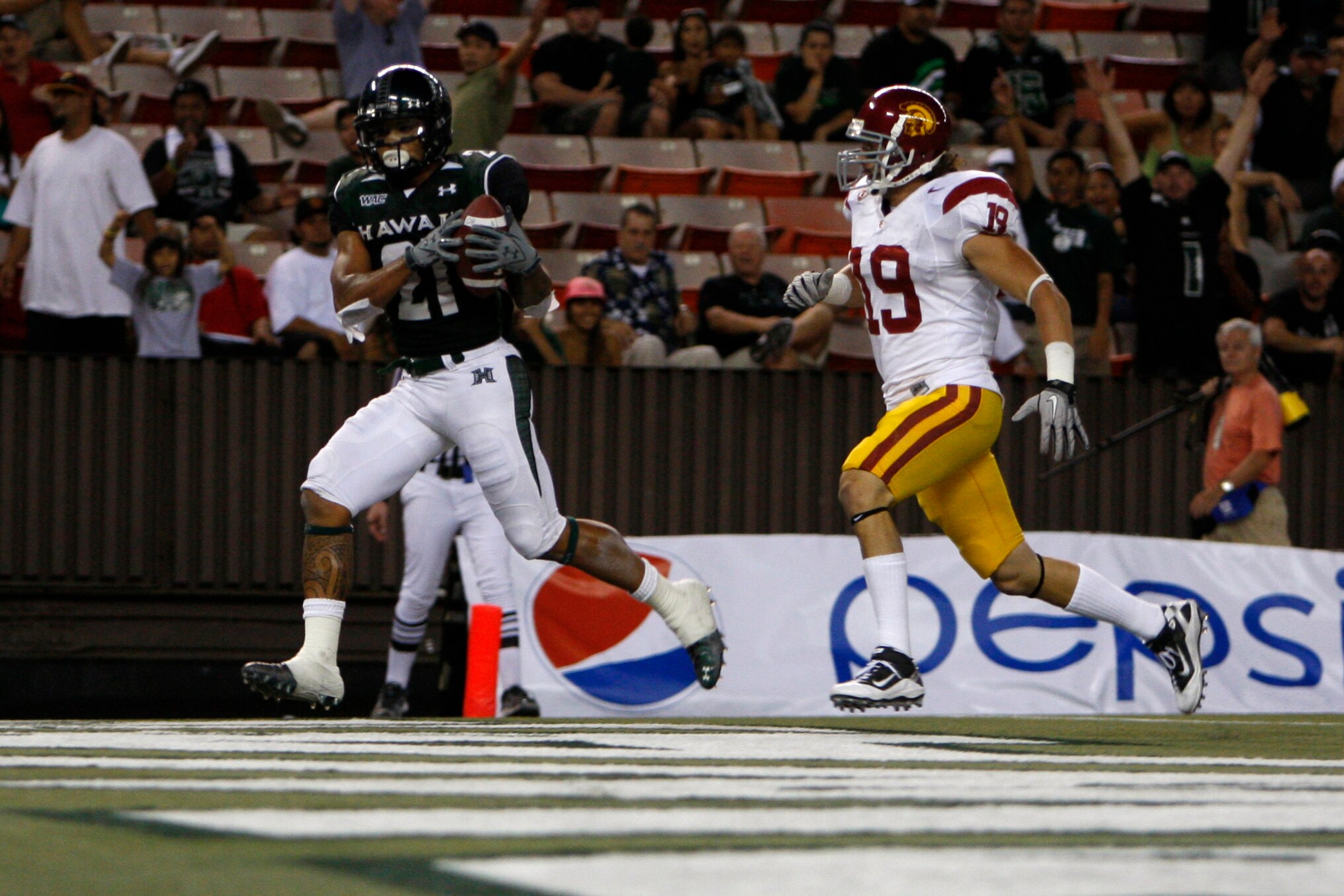 HONOLULU - SEPTEMBER 2:  Kealoha Pilares of the University of Hawaii Warriors  scores a touchdown during secondhalf action at Aloha Stadium September 2, 2010 in Honolulu, Hawaii. (Photo by Kent Nishimura/Getty Images)