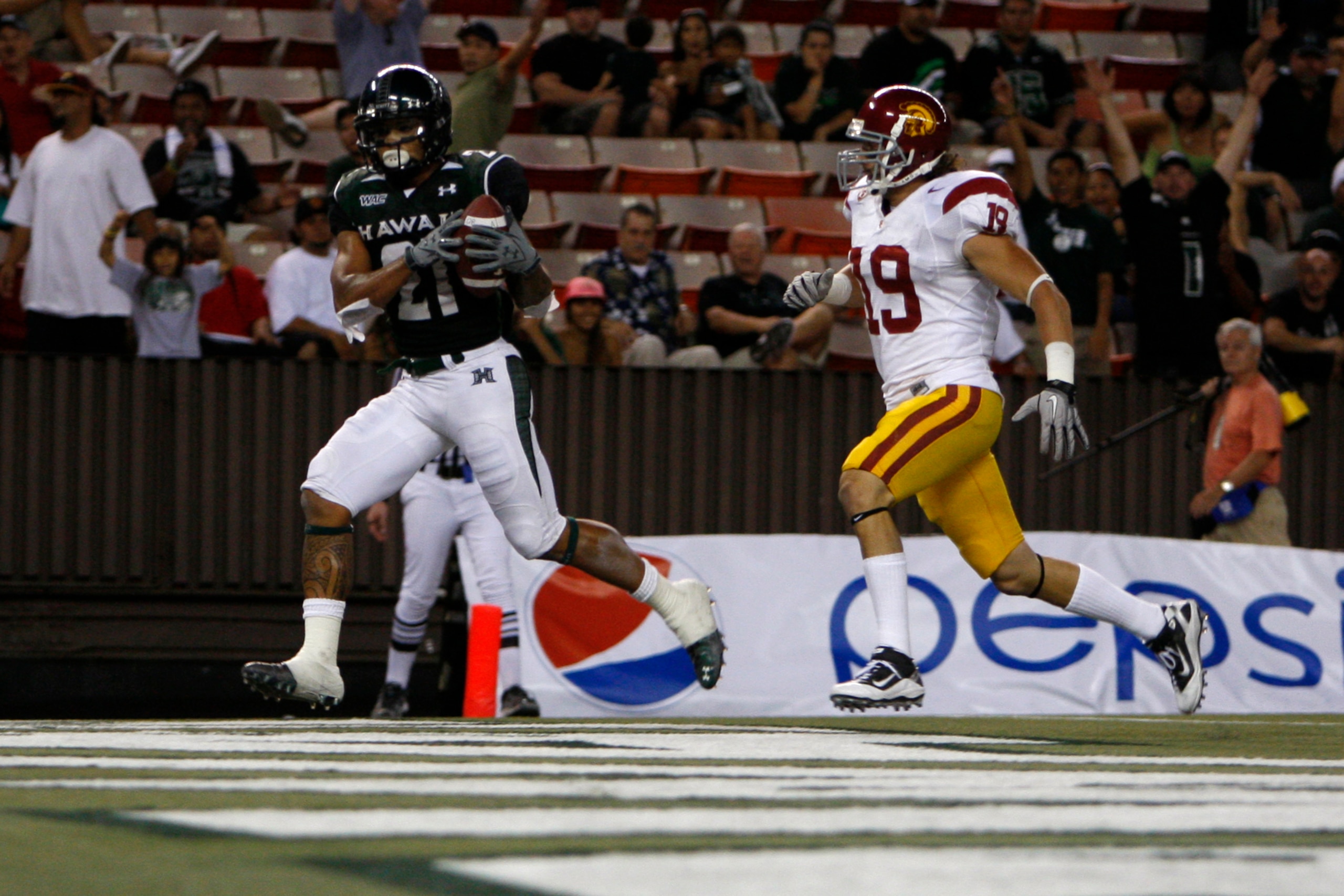 HONOLULU - SEPTEMBER 2:  Kealoha Pilares of the University of Hawaii Warriors  scores a touchdown during secondhalf action at Aloha Stadium September 2, 2010 in Honolulu, Hawaii. (Photo by Kent Nishimura/Getty Images)