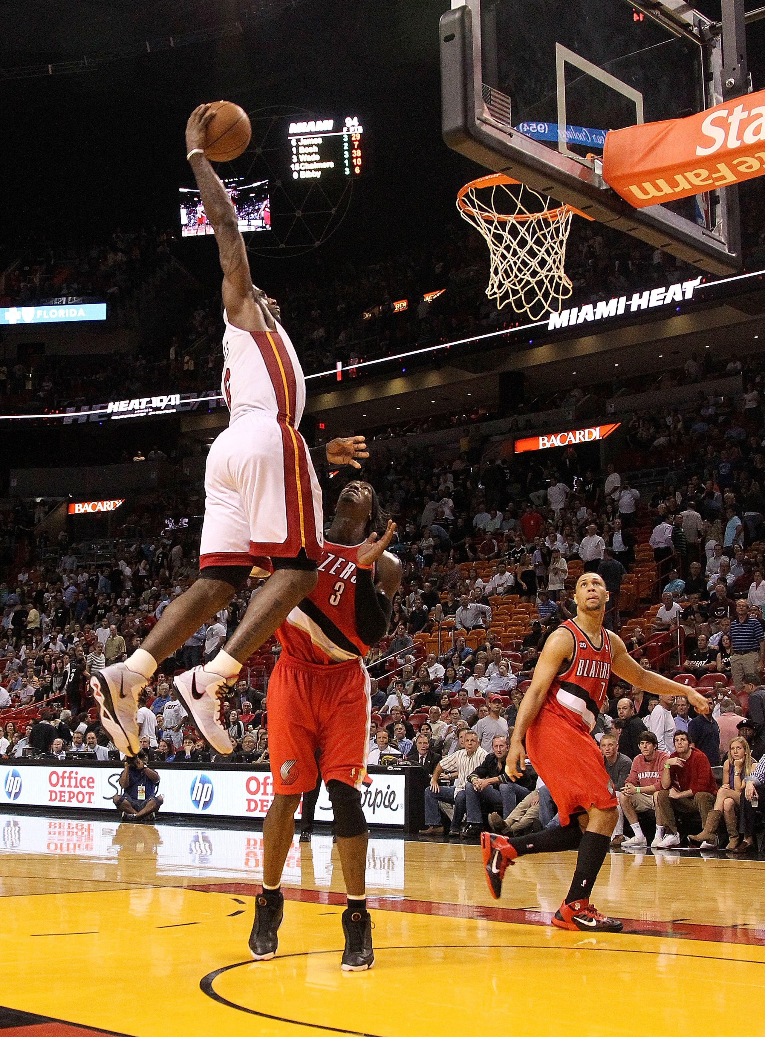 MIAMI, FL - MARCH 08:  LeBron James #6 of the Miami Heat dunks over Gerald Wallace #3 of the Portland Trail Blazers during a game at American Airlines Arena on March 8, 2011 in Miami, Florida. NOTE TO USER: User expressly acknowledges and agrees that, by