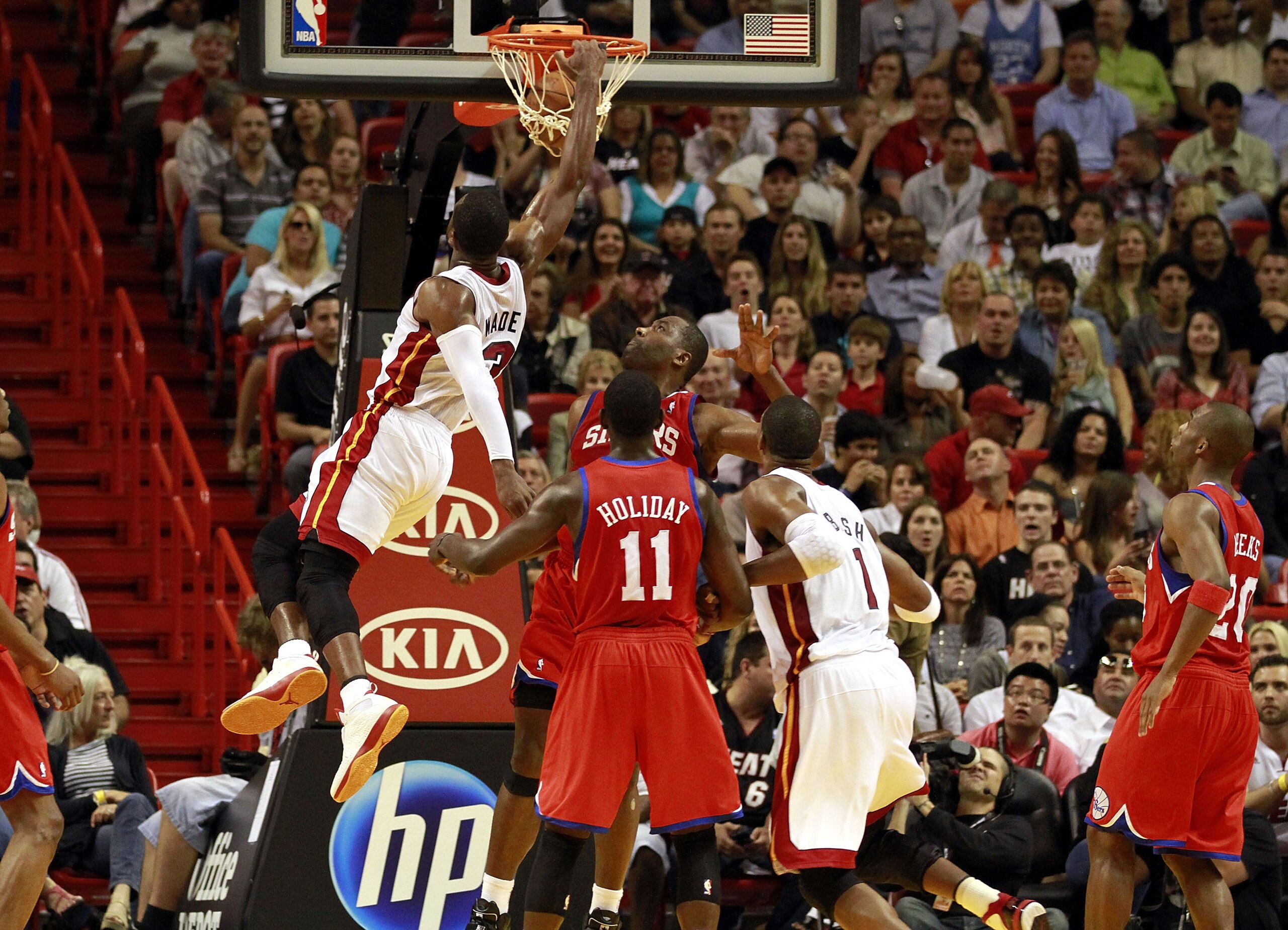 MIAMI, FL - MARCH 25:  Guard Dwyane Wade #3 of the Miami Heat dunks during a game againts the Philadelphia Sixers at American Airlines Arena on March 25, 2011 in Miami, Florida. NOTE TO USER: User expressly acknowledges and agrees that, by downloading and