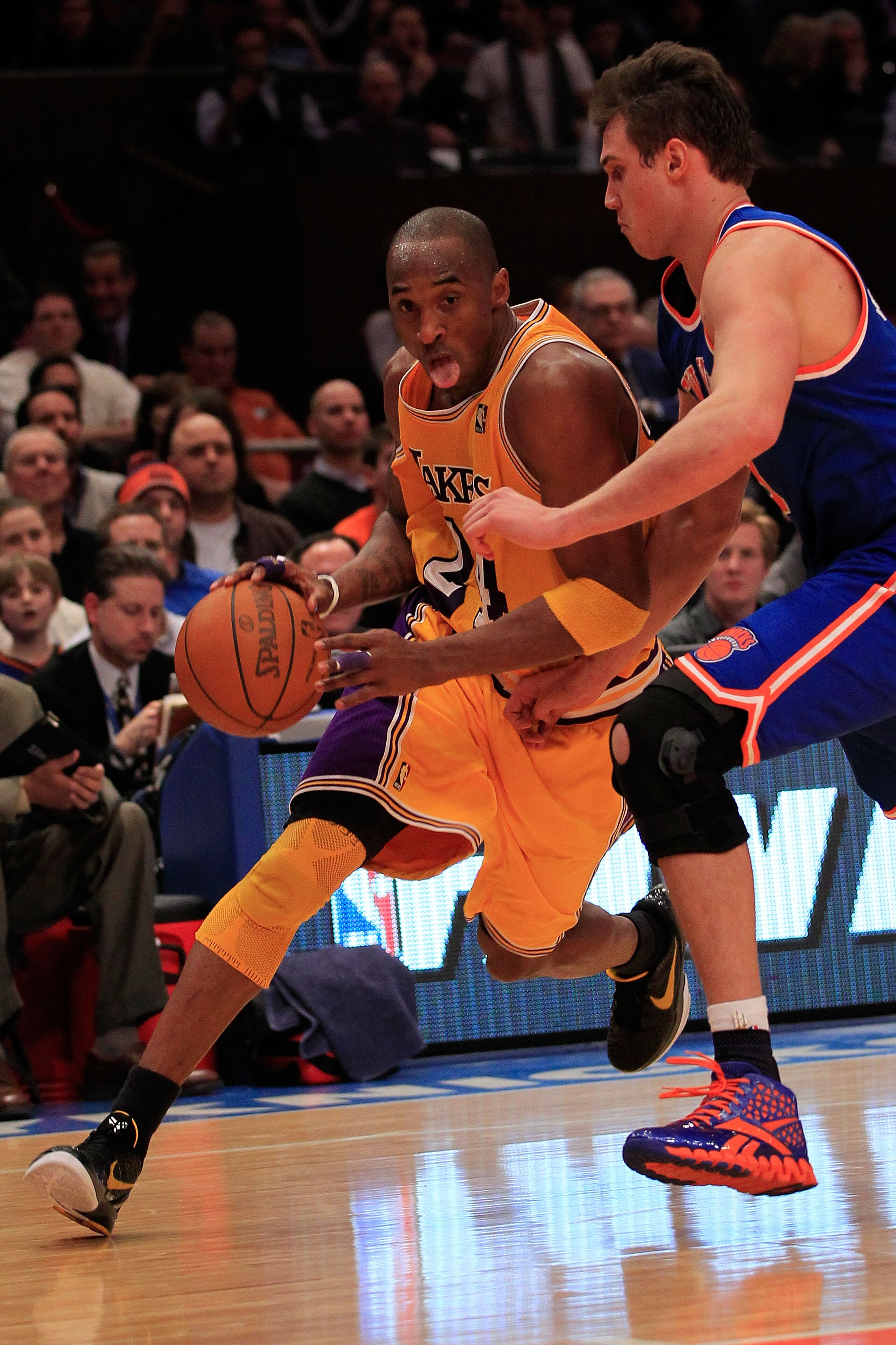 NEW YORK, NY - FEBRUARY 11: Kobe Bryant #24 of the Los Angeles Lakers drives past Danilo Gallinari #8 of the New York Knicks at Madison Square Garden on February 11, 2011 in New York City. NOTE TO USER: User expressly acknowledges and agrees that, by down