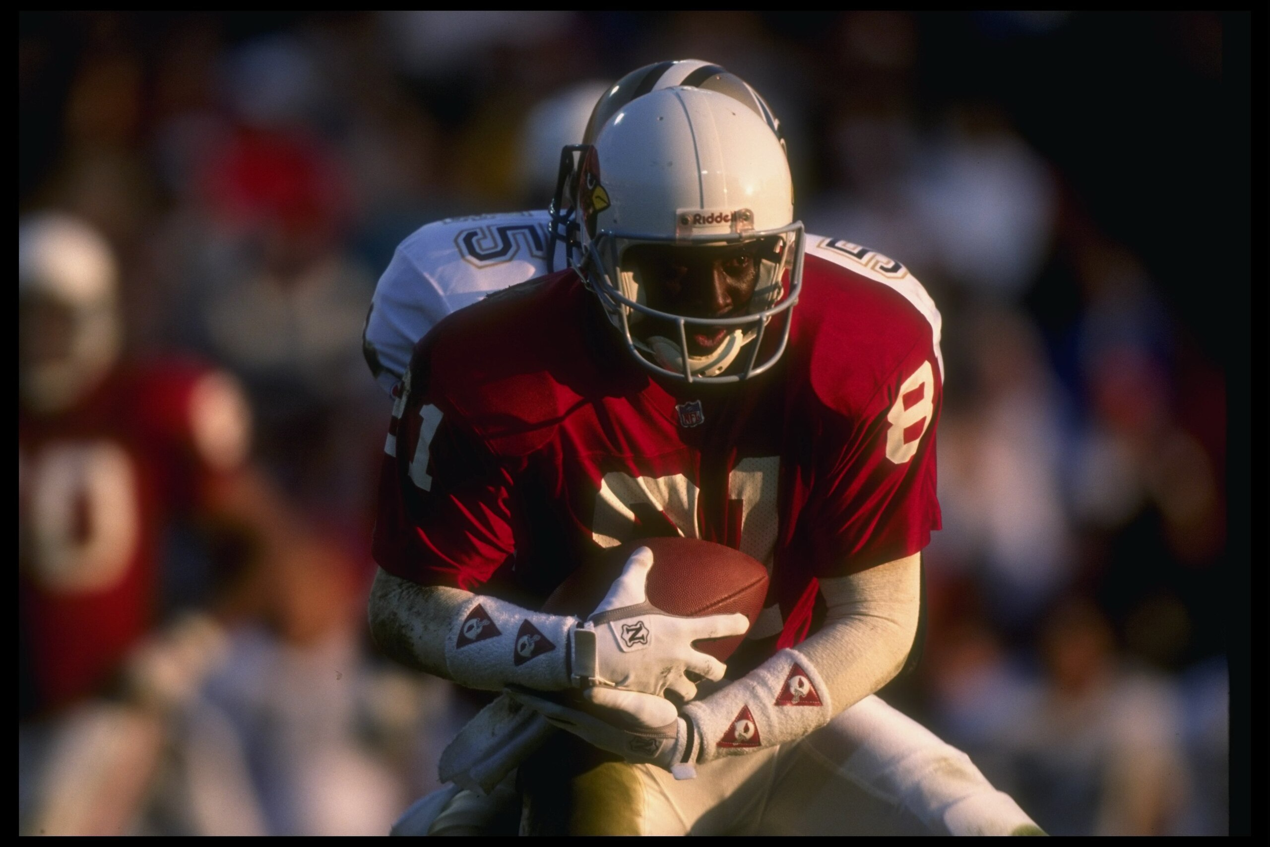 Wide receiver Ernie Jones of the Phoenix Cardinals runs with the ball during a game against the New Orleans Saints at the Superdome in New Orleans, Louisiana. The Saints won the game, 27-3.