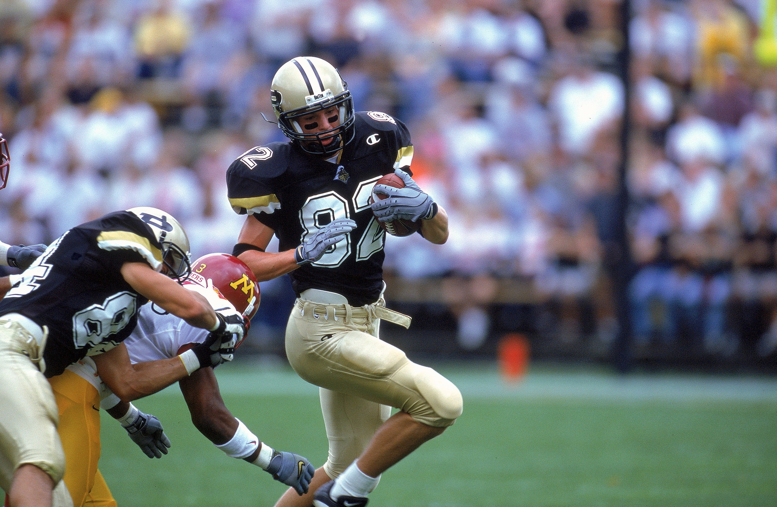 23 Sep 2000: John Standeford #82 of the Purdue Boilermakers carries the ball as he avoides a tackle during the game against the Minnesota Golden Gophers at the Ross-Ade Stadium in West Lafayette, Indiana. The Boilermakers defeated the Golden Gophers 38-24