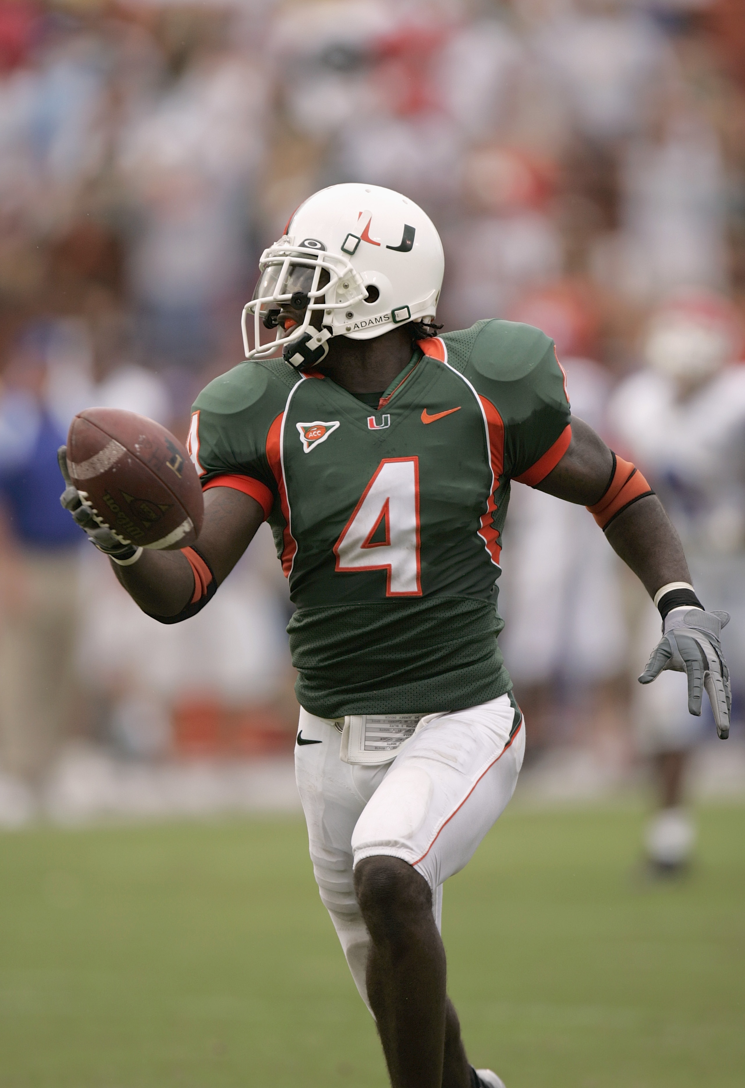 MIAMI - SEPTEMBER 18:  Wide receiver Devin Hester #4 of the University of Miami Hurricanes runs upfield against the Louisiana Tech Bulldogs during the game on September 18, 2004 at the Orange Bowl in Miami, Florida.  The Hurricanes defeated the Bulldogs 4