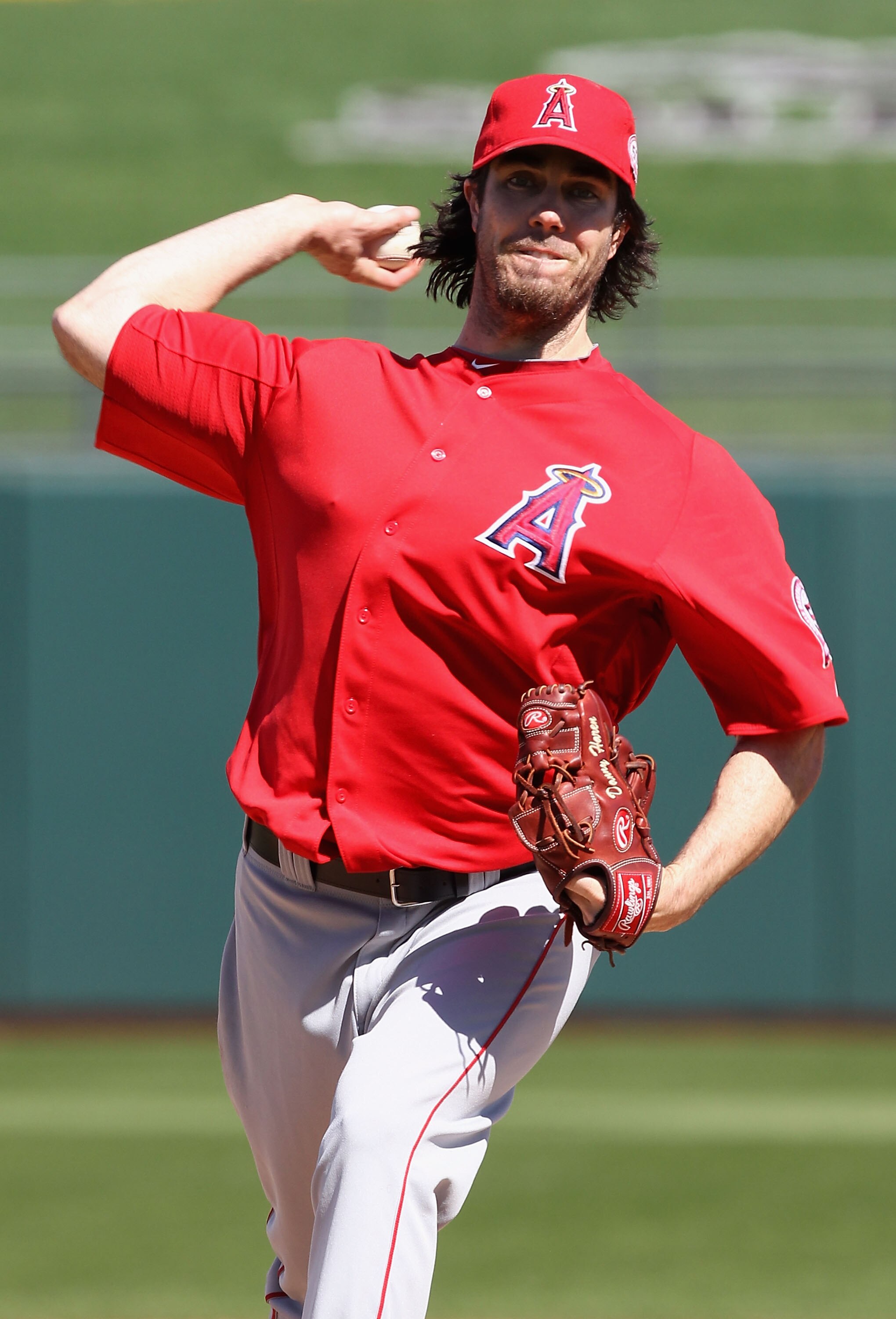 SURPRISE, AZ - MARCH 02:  Starting pitcher Dan Haren #24 of the Los Angeles Angels of Anaheim pitches against the Texas Rangers during the spring training game at Surprise Stadium on March 2, 2011 in Surprise, Arizona.  (Photo by Christian Petersen/Getty