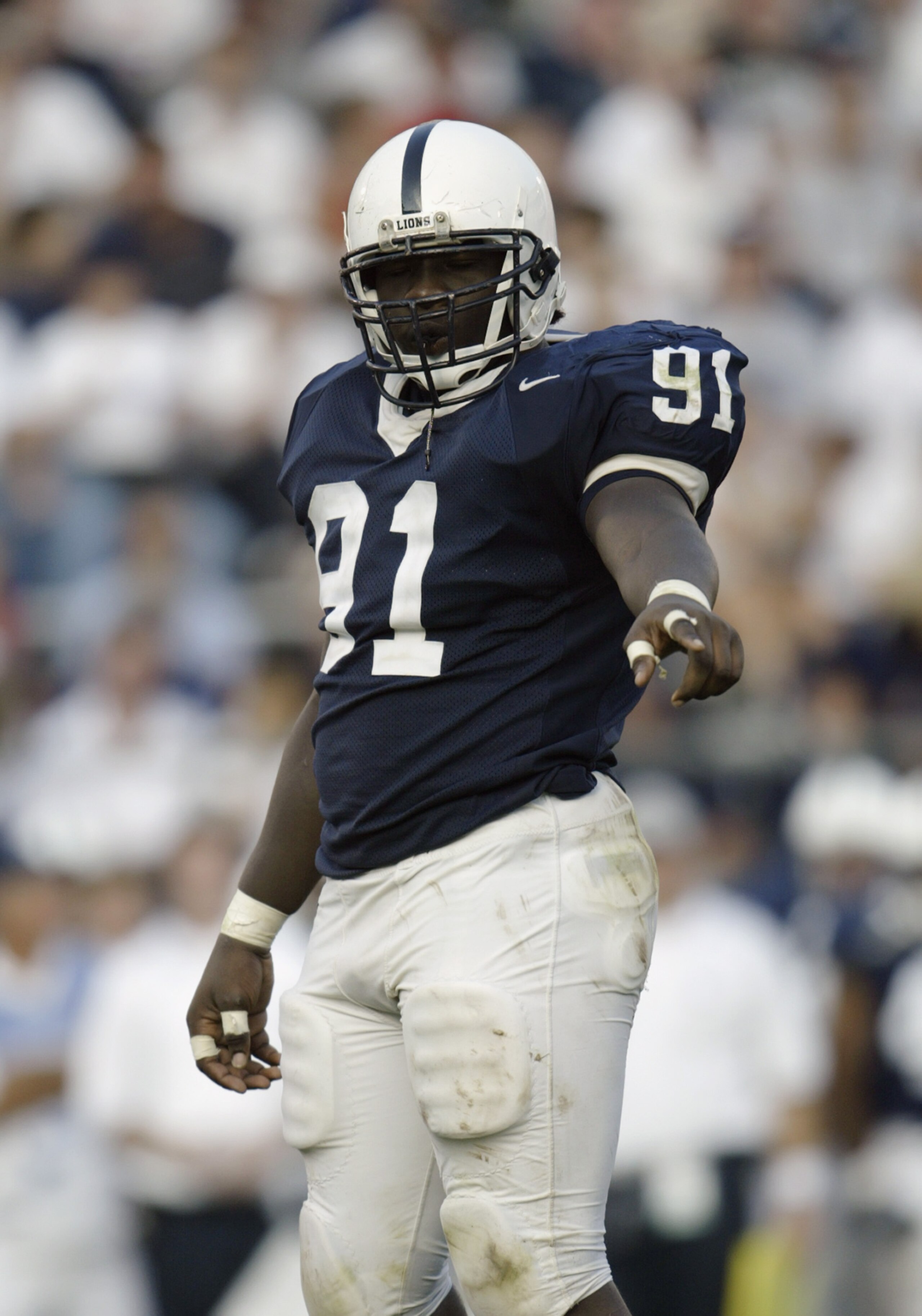STATE COLLEGE, PA - AUGUST 30:  Defensive tackle Tamba Hali #91 of the Pennsylvania State University Nittany Lions points during the game against the Temple University Owls at Beaver Stadium on August 30, 2003 in State College, Pennsylvania. Penn State de