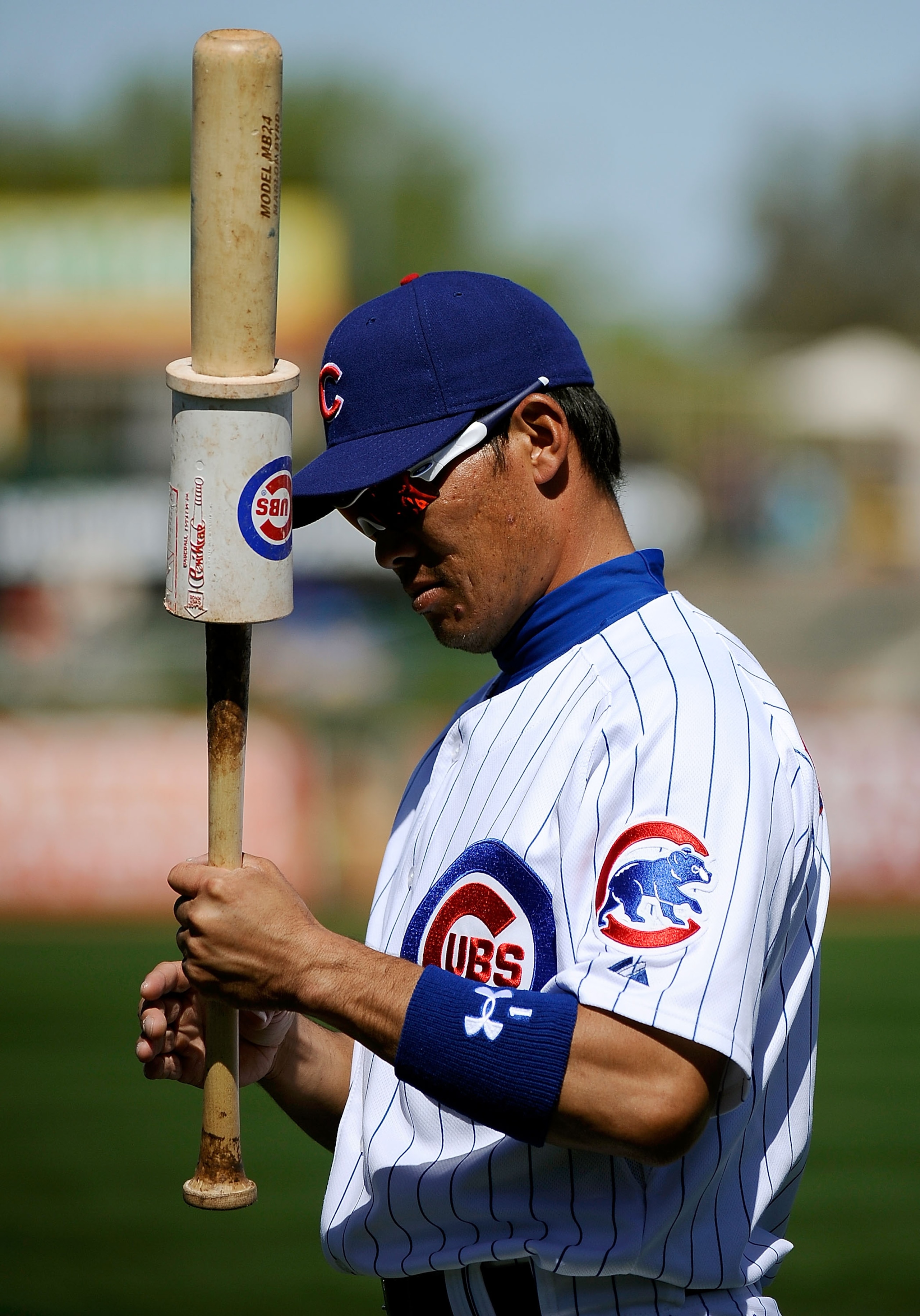 MESA, AZ - MARCH 09:  Kosuke Fukudome #1 of the Chicago Cubs warms up prior to the start of the spring training baseball game against the Kansas City Royals at HoHoKam Stadium on March 9, 2011 in Mesa, Arizona.  (Photo by Kevork Djansezian/Getty Images)