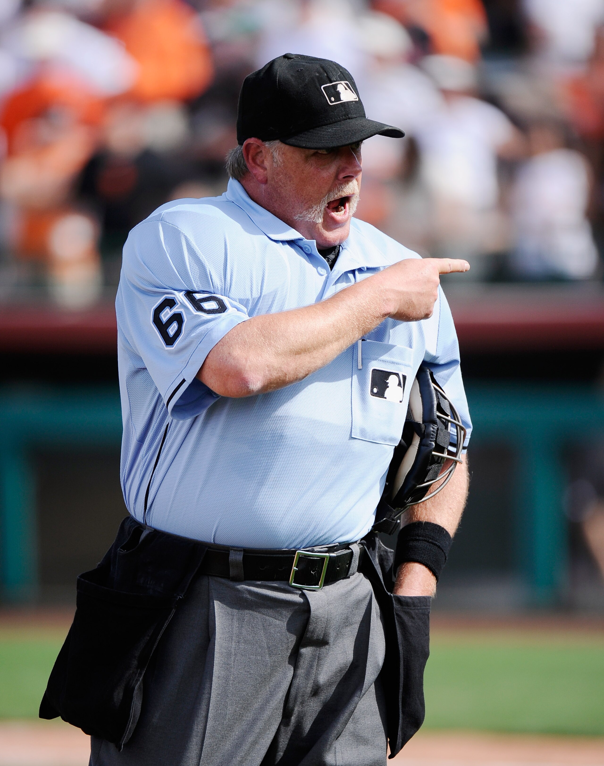 SCOTTSDALE, AZ - MARCH 18:  Home plate umpire Jim Joyce #66 argues strikes and balls with Juan Uribe #5 of the Los Angeles Dodgers  after Uribe was called out on strikes against the San Francisco Giants during the seventh inning of the baseball game at Sc