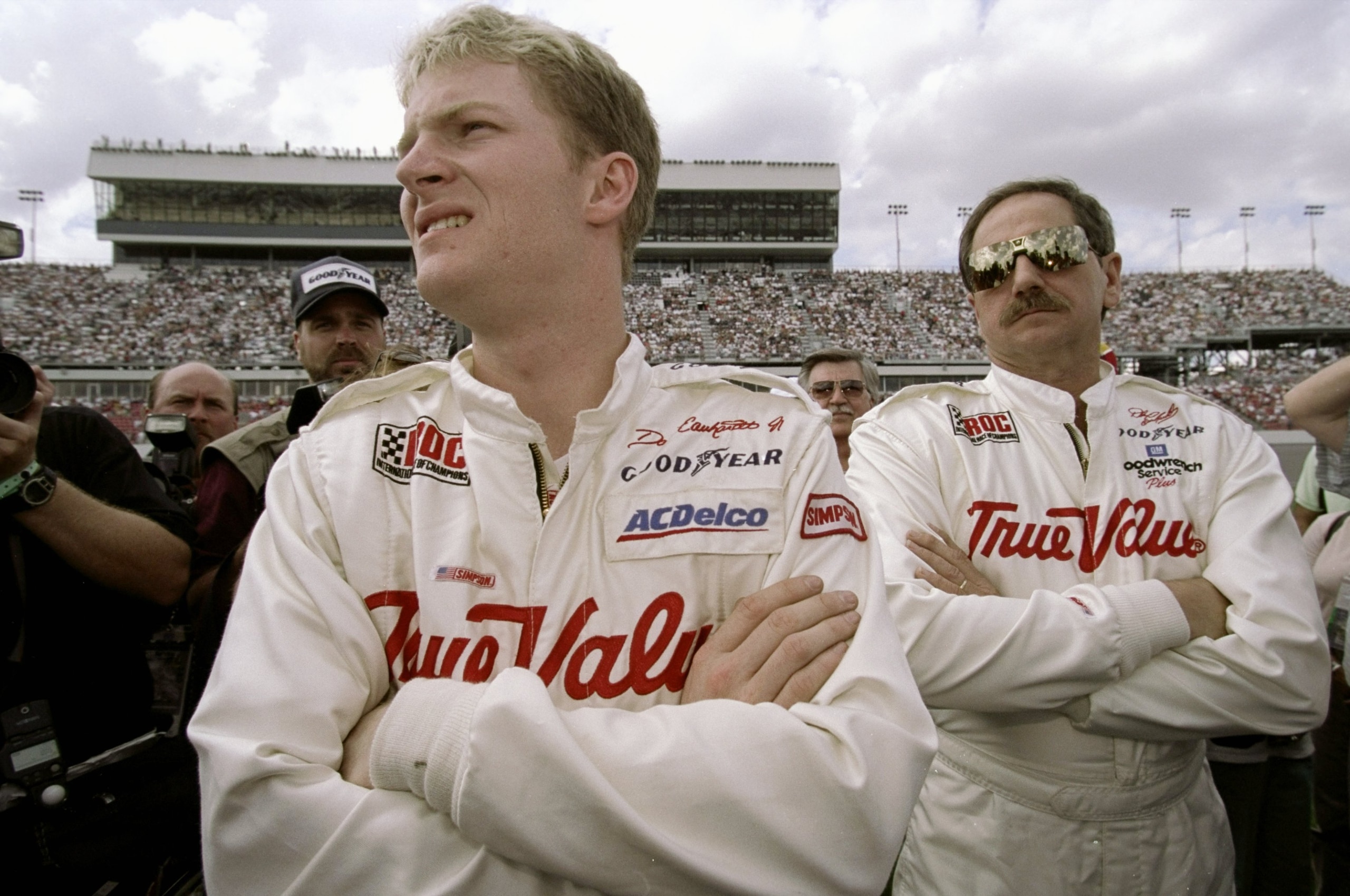 12 Feb 1999: Dale Earnhardt Jr.(L) stands with Dale Earnhardt Sr. during the I.R.O.C Race at the Daytona Speedweek in Daytona, Florida. Mandatory Credit: Jamie Squire  /Allsport