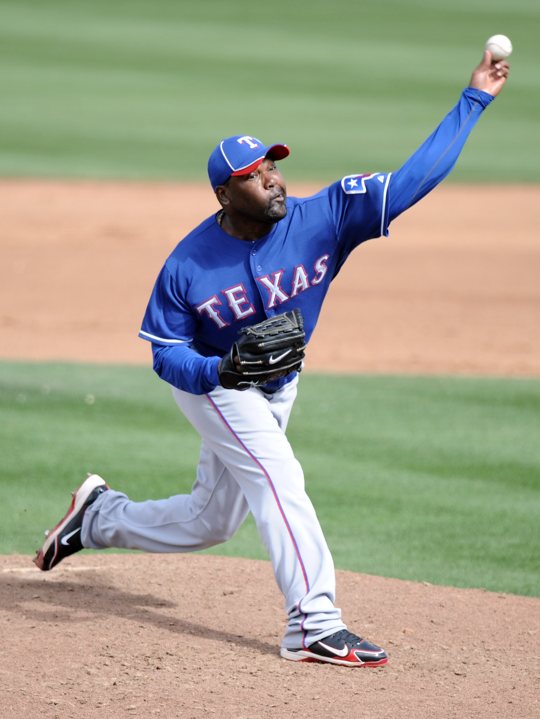 PEORIA, AZ - MARCH 01:  Arthur Rhodes #53 of the Texas Rangers pitches against the Seattle Mariners during spring training at Peoria Stadium on March 1, 2011 in Peoria, Arizona.  (Photo by Harry How/Getty Images)