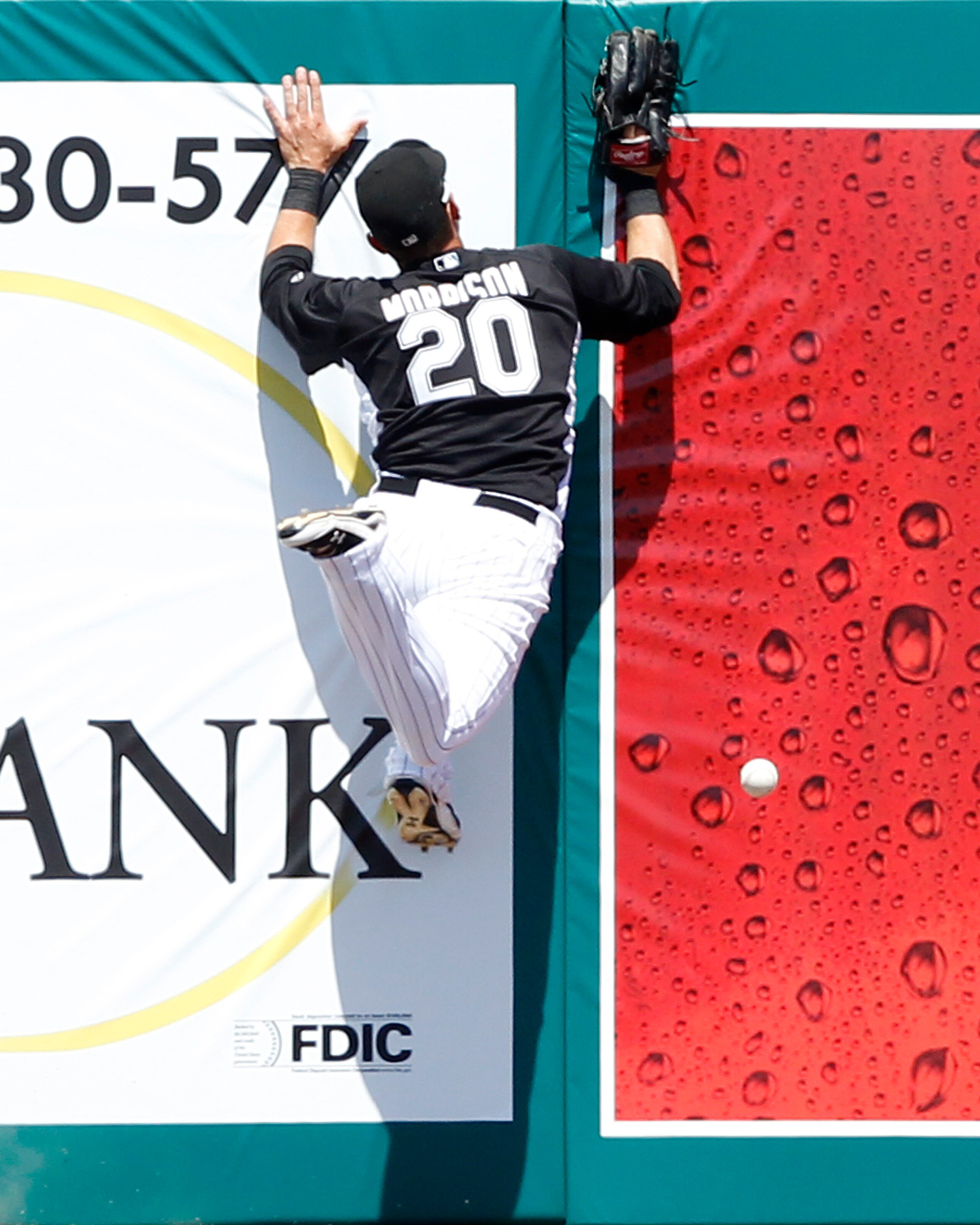 JUPITER, FL - MARCH 24: Logan Morrison #20 of the Florida Marlins can not catch the ball hit by Jarrod Saltalamacchia #39 (not pictured) of the Boston Red Sox which scored two runs in the third inning at Roger Dean Stadium on March 24, 2011 in Jupiter, Fl