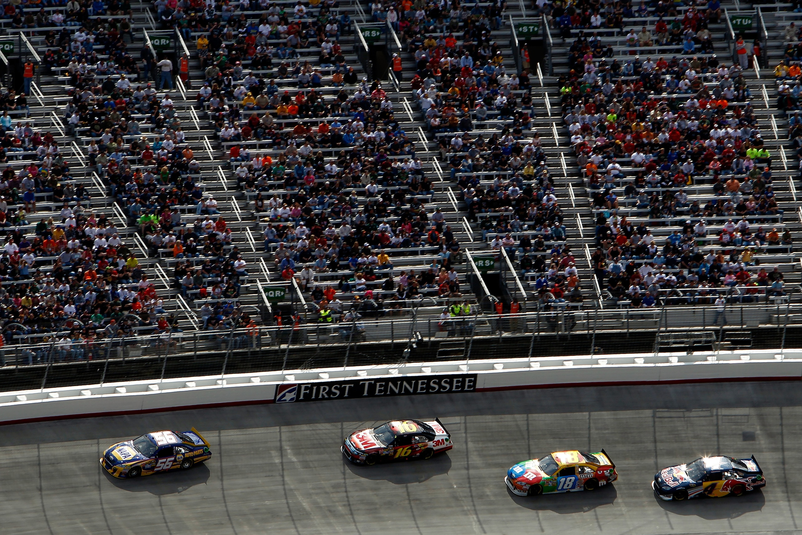 BRISTOL, TN - MARCH 20:  Martin Truex Jr., driver of the #56 NAPA Auto Parts Toyota, leads Greg Biffle, driver of the #16 3M Ford, Kyle Busch, driver of the #18 M&M's Toyota, and Kasey Kahne, driver of the #4 Red Bull Toyota, during the NASCAR Sprint Cup