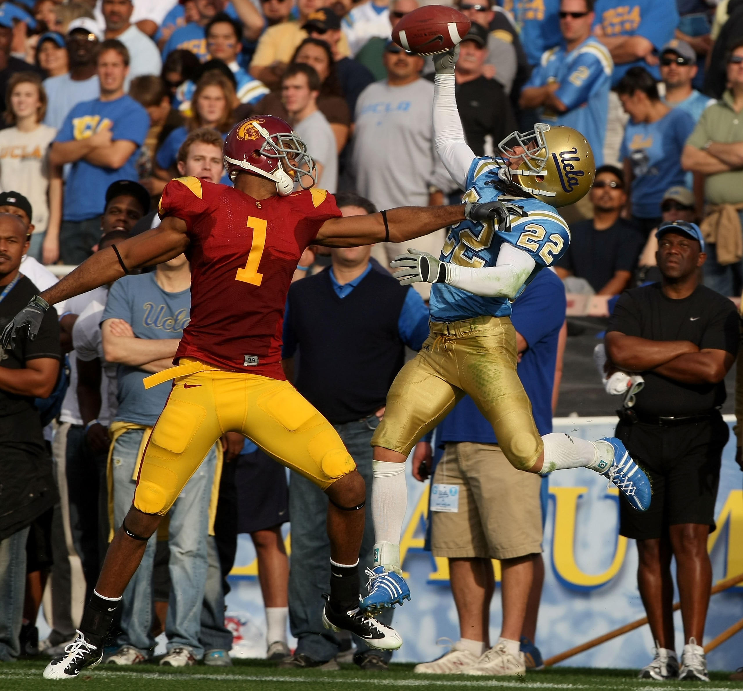 PASADENA, CA - DECEMBER 06:  Michael Norris #22 of the UCLA Bruins catches an interception out of bounds over T.J. Bryant #1 of the USC Trojans during the game on December 6, 2008 at the Rose Bowl in Pasadena, California. The call was overruled and called