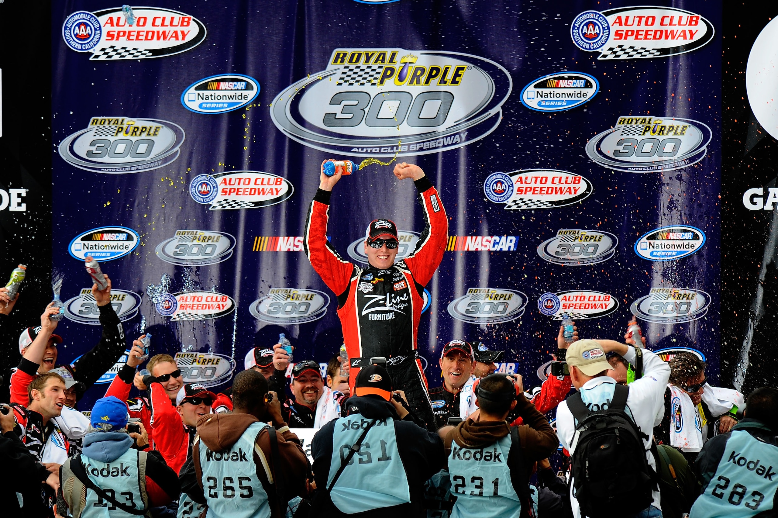 FONTANA, CA - MARCH 26:  Kyle Busch, driver of the #18 Z-Line Designs Toyota, celebrates in victory lane after winning the NASCAR Nationwide Series Royal Purple 300 at Auto Club Speedway on March 26, 2011 in Fontana, California.  (Photo by Jared C. Tilton