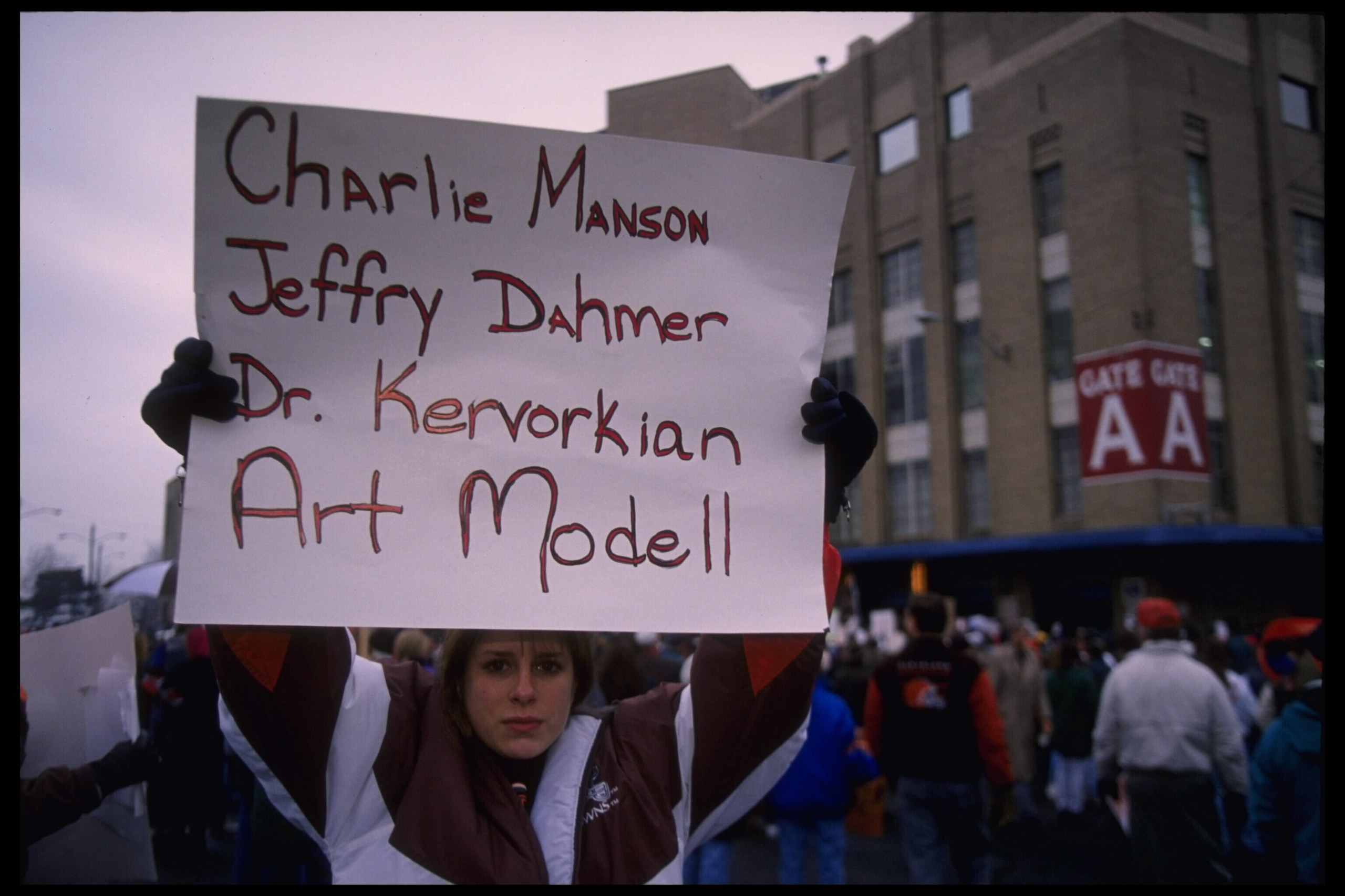 19 Nov 1995: Fans hold various signs which accuse Cleveland Browns owner Art Modell of disregard of fans which compares him to famous murderers at Cleveland Stadium in Cleveland, Ohio. The Packers defeated the Browns that day 31-20.