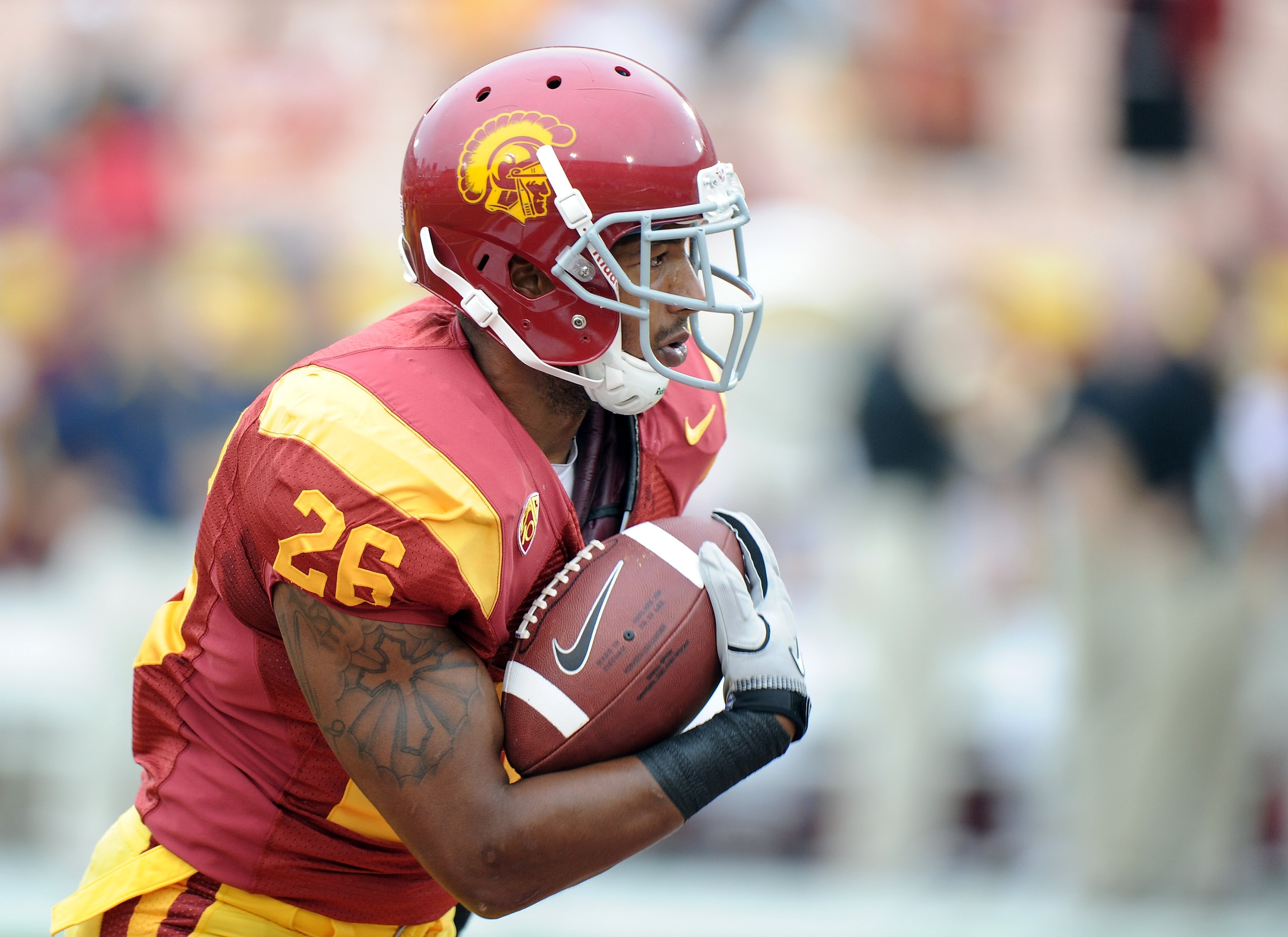 LOS ANGELES, CA - OCTOBER 16:  Marc Tyler #26 of the USC Trojans warms up before the game against the California Golden Bears at Los Angeles Memorial Coliseum on October 16, 2010 in Los Angeles, California.  (Photo by Harry How/Getty Images)