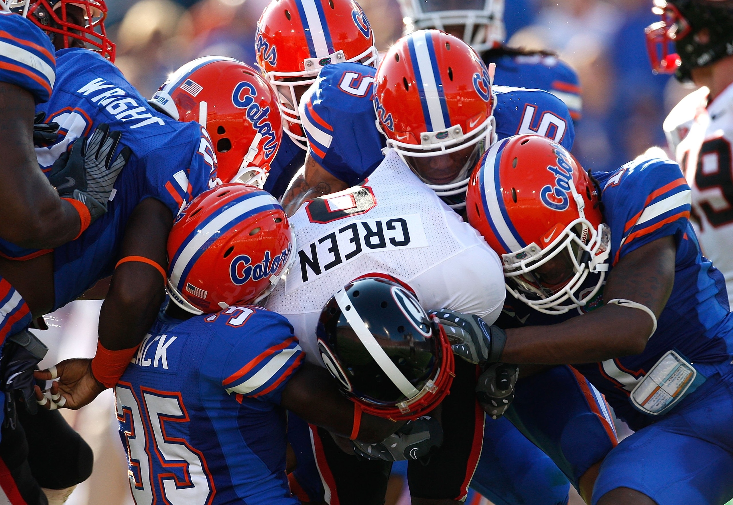 JACKSONVILLE, FL - OCTOBER 31:  The Florida Gators defense tackles A.J. Green #8 of the Georgia Bulldogs at Jacksonville Municipal Stadium on October 31, 2009 in Jacksonville, Florida.  (Photo by Kevin C. Cox/Getty Images)