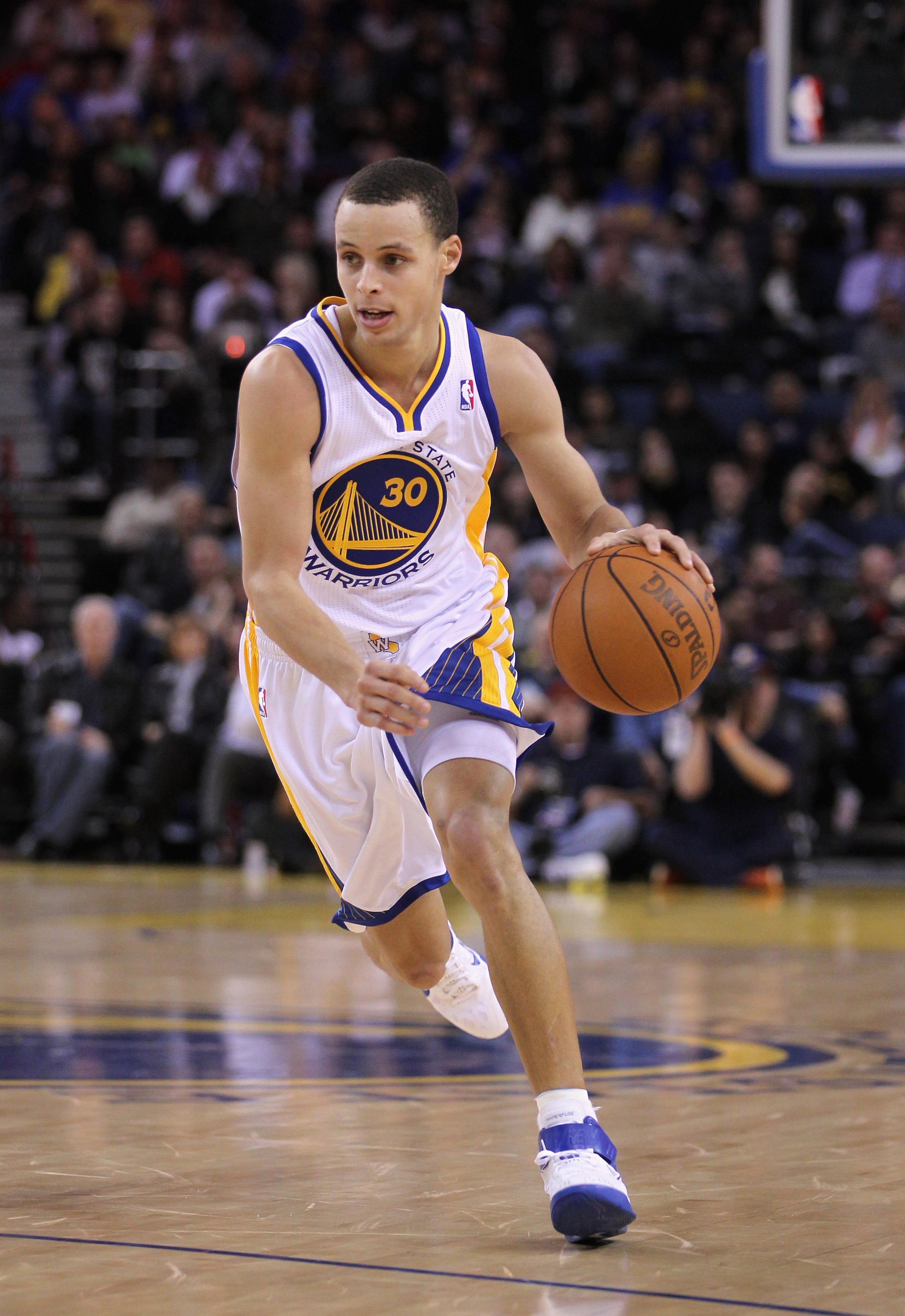 OAKLAND, CA - MARCH 25:  Stephen Curry #30 of the Golden State Warriors in action against the Toronto Raptors at Oracle Arena on March 25, 2011 in Oakland, California. NOTE TO USER: User expressly acknowledges and agrees that, by downloading and or using