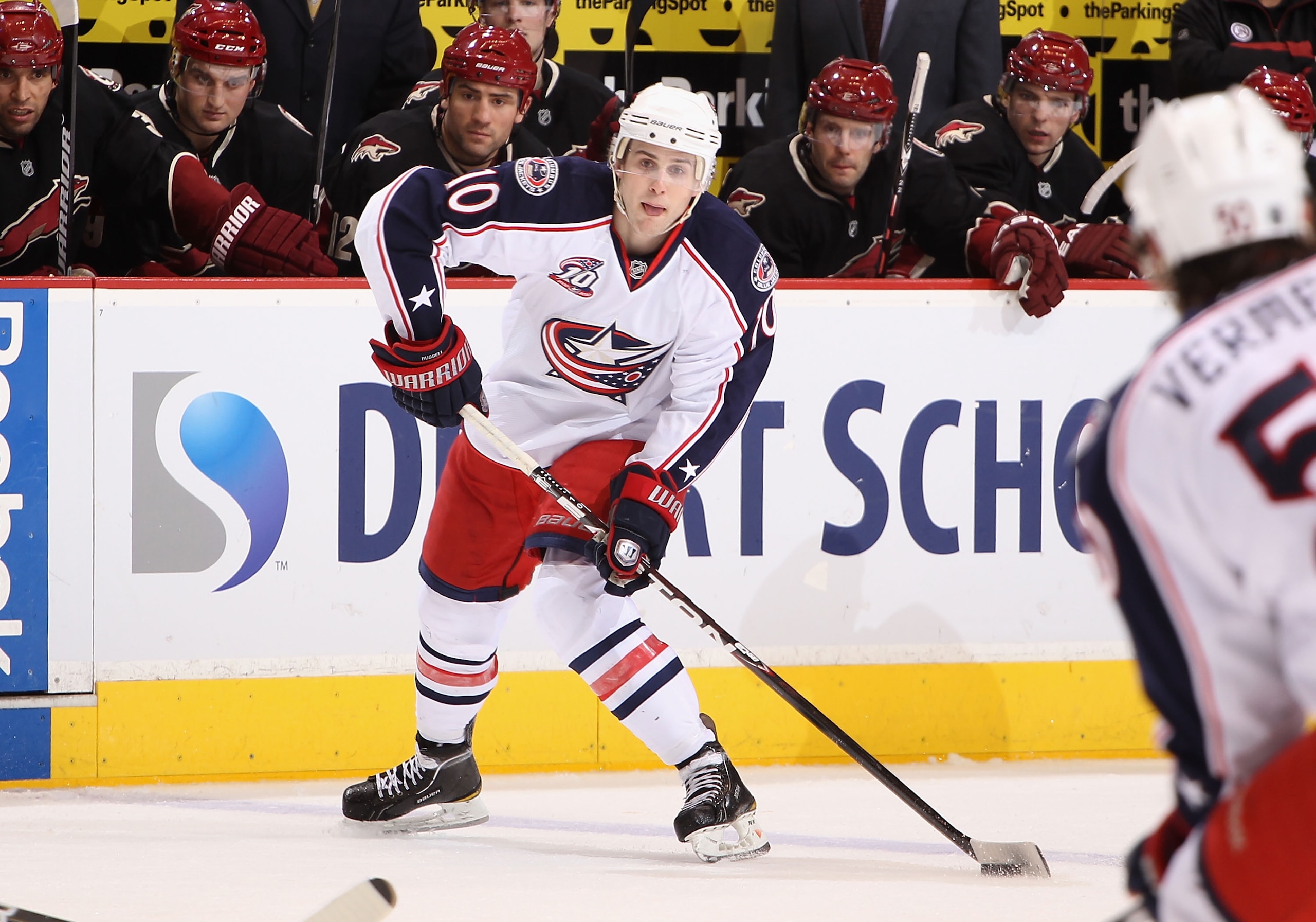 GLENDALE, AZ - MARCH 24:  Kris Russell #10 of the Columbus Blue Jackets skates with the puck during the NHL game against the Phoenix Coyotes at Jobing.com Arena on March 24, 2011 in Glendale, Arizona.  The Coyotes defeated the Blue Jackets 3-0.  (Photo by