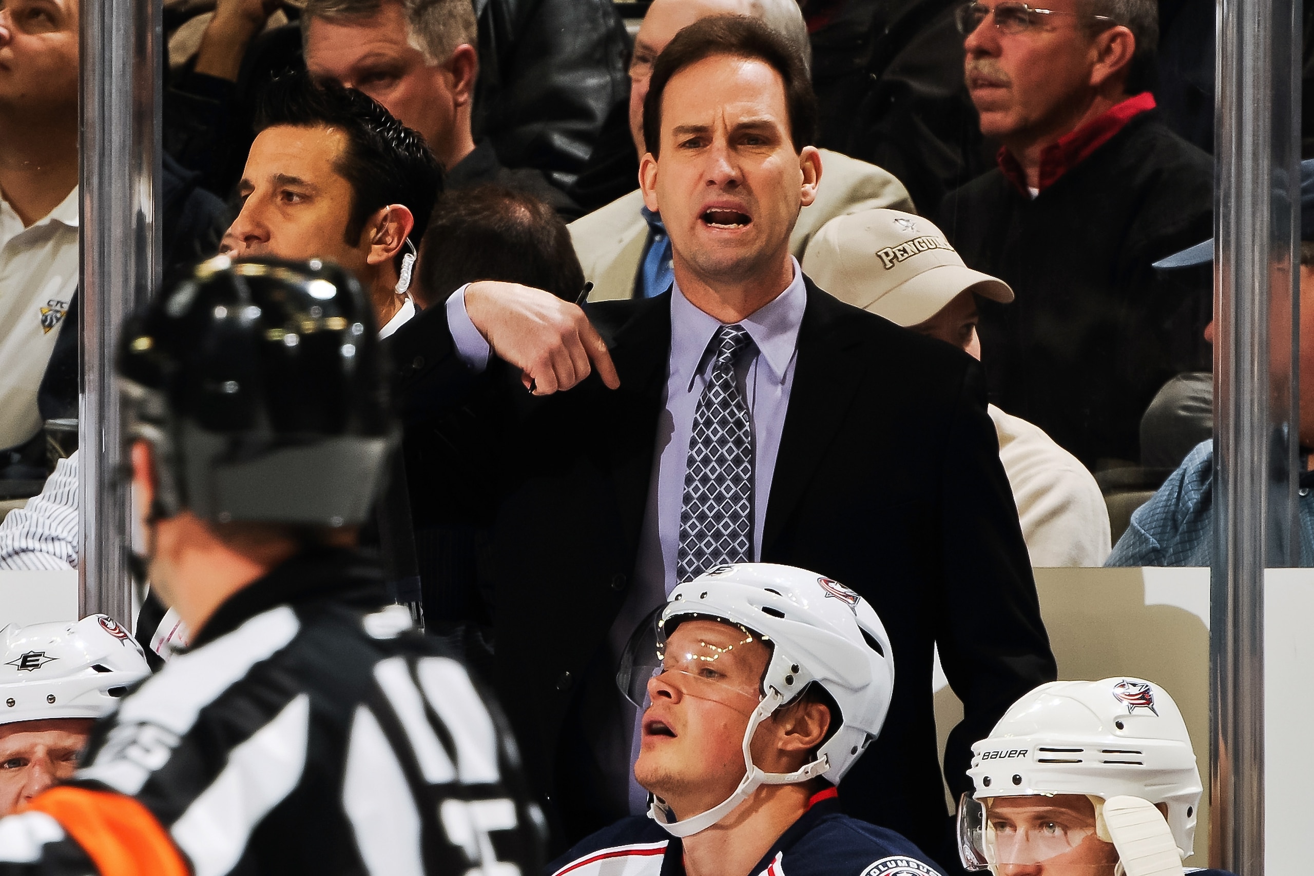 PITTSBURGH, PA - FEBRUARY 8:  Head Coach Scott Arniel of the Columbus Blue Jackets talks with a referee during a game against the Pittsburgh Penguins on February 8, 2011 at CONSOL Energy Center in Pittsburgh, Pennsylvania.  (Photo by Jamie Sabau/Getty Ima