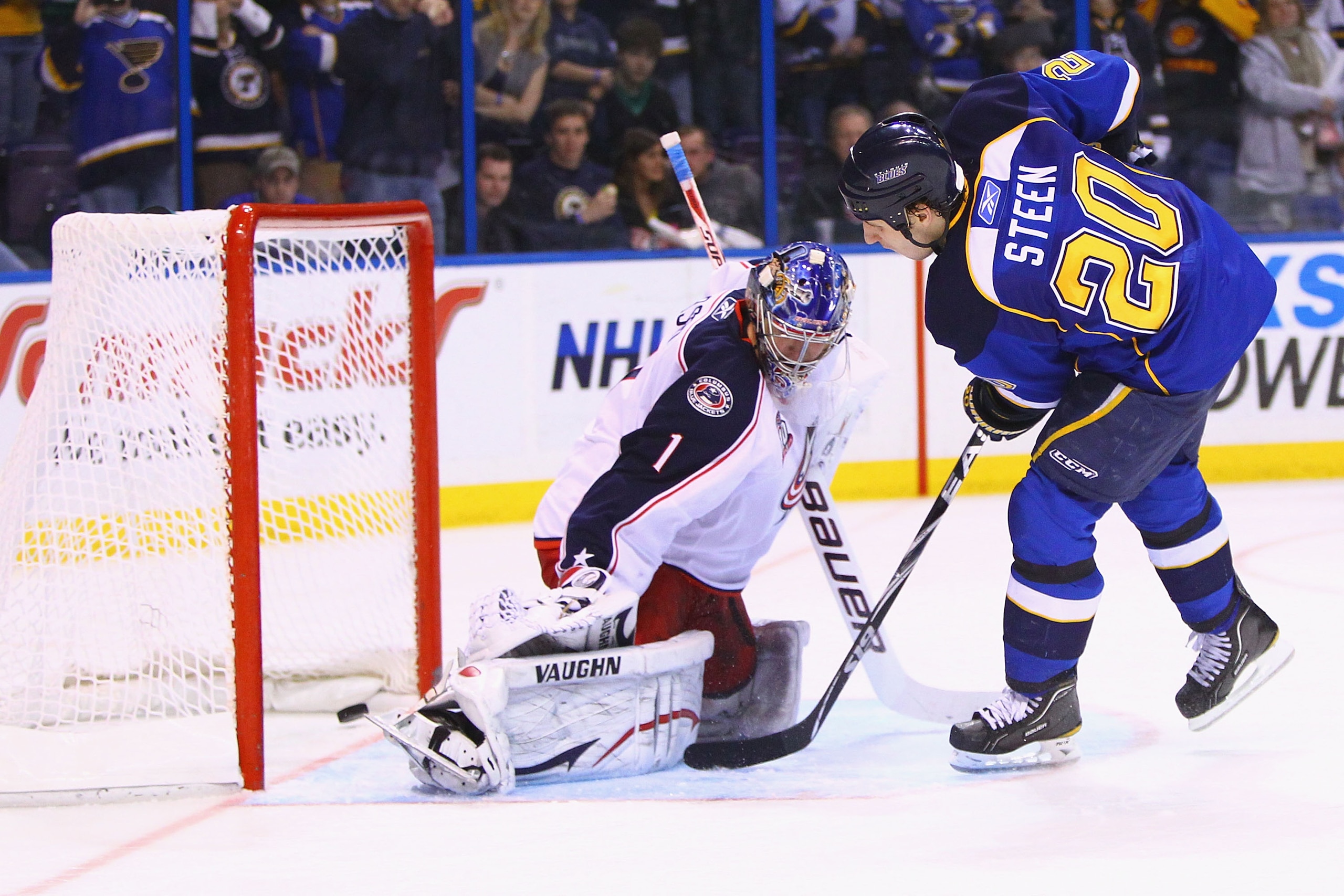 ST. LOUIS, MO - MARCH 7: Alexander Steen #20 of the St. Louis Blues scores the game-winning goal against Steve Mason #1 of the Columbus Blue Jackets at the Scottrade Center on March 7, 2011 in St. Louis, Missouri.  The Blues beat the Bluejackets 5-4 in a