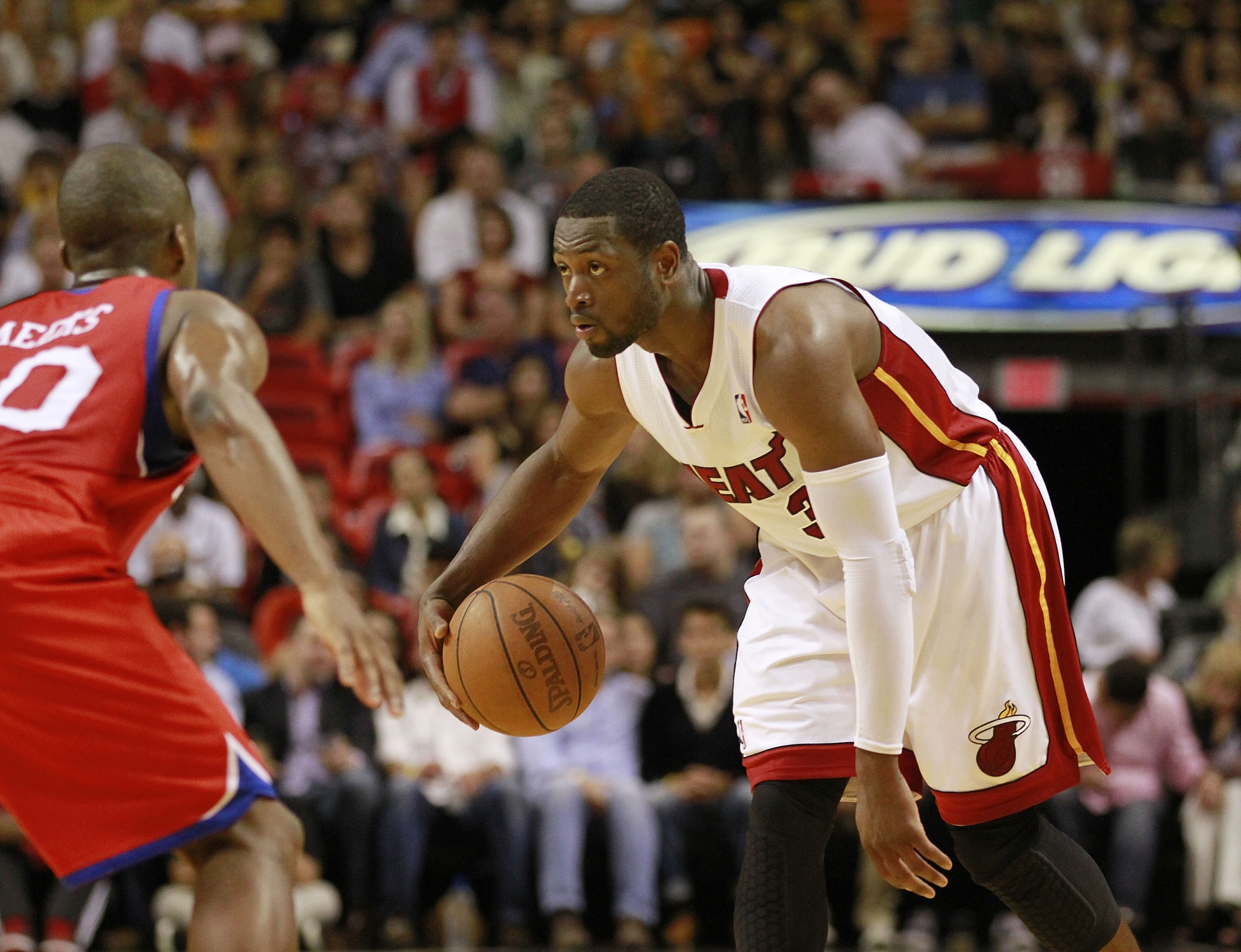 MIAMI, FL - MARCH 25:  Guard Dwyane Wade #3 of the Miami Heat drives against Guard Jodie Meeks #20 of the Philadelphia 76ers at American Airlines Arena on March 25, 2011 in Miami, Florida. The Heat defeated the Sixers 111-99. NOTE TO USER: User expressly