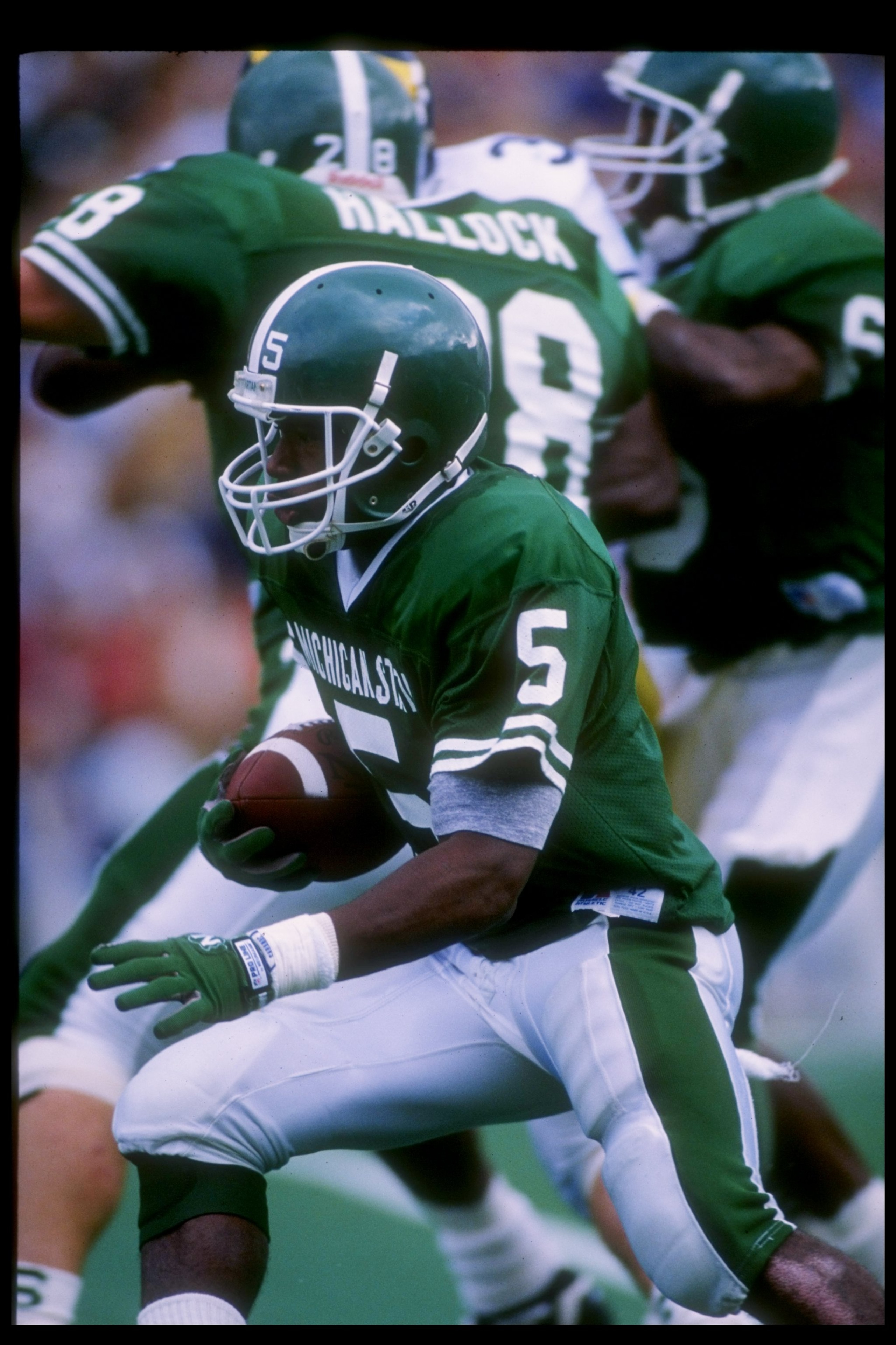 12 Oct 1991: Flanker Courtney Hawkins of the Michigan State Spartans runs down the field during a game against the Michigan Wolverines at Spartan Stadium in East Lansing, Michigan. Michigan won the game 45-28.