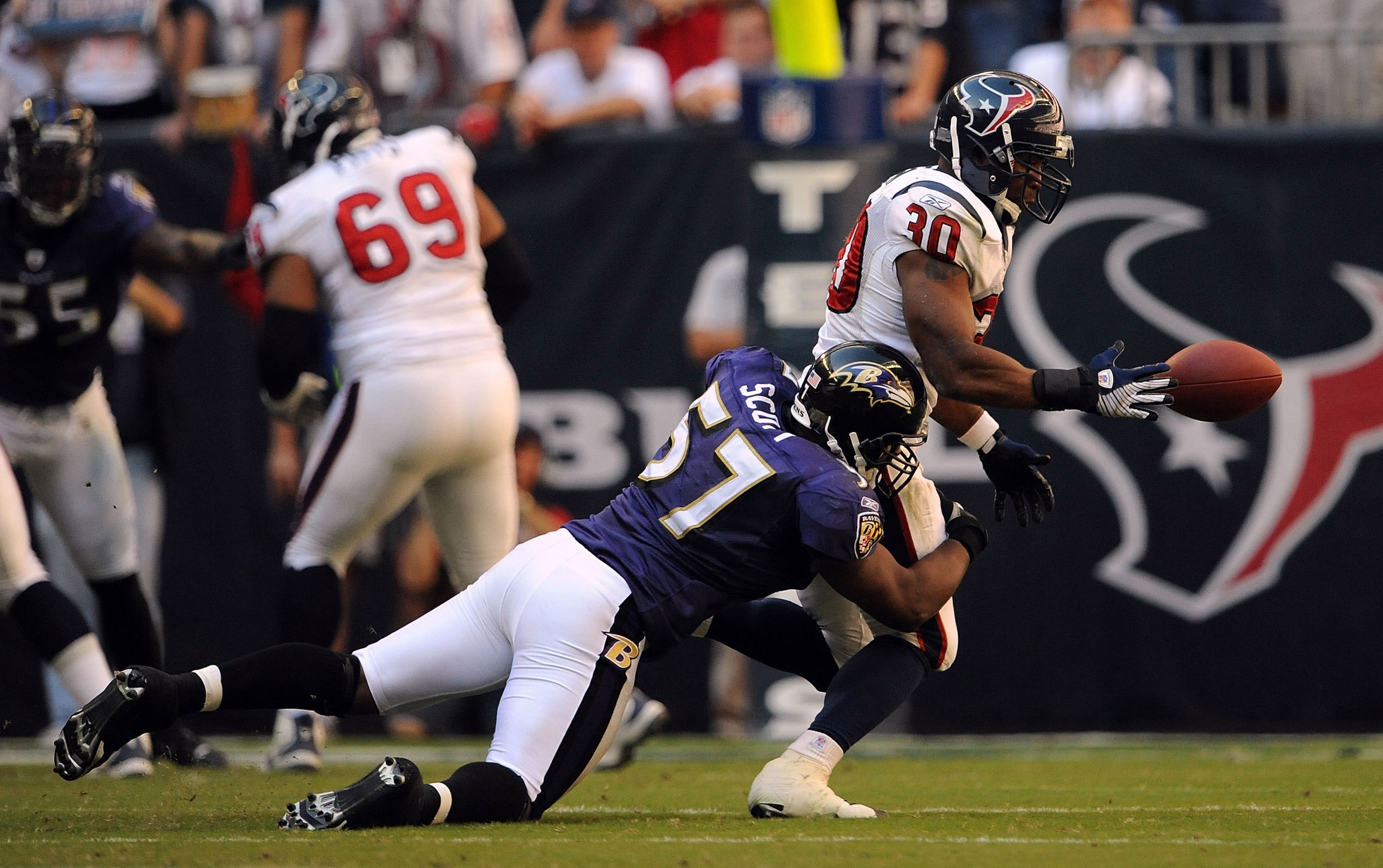 HOUSTON - NOVEMBER 09: Running back Ahman Green #30 of the Houston Texans drops a pass while tackled by Bart Scott #57 of the Baltimore Ravens at Reliant Stadium on November 9, 2008 in Houston, Texas. (Photo by Ronald Martinez/Getty Images) HOUSTON - NOVEMBER 09: Running back Ahman Green #30 of the Houston Texans drops a pass while tackled by Bart Scott #57 of the Baltimore Ravens at Reliant Stadium on November 9, 2008 in Houston, Texas. (Photo by Ronald Martinez/Getty Images)