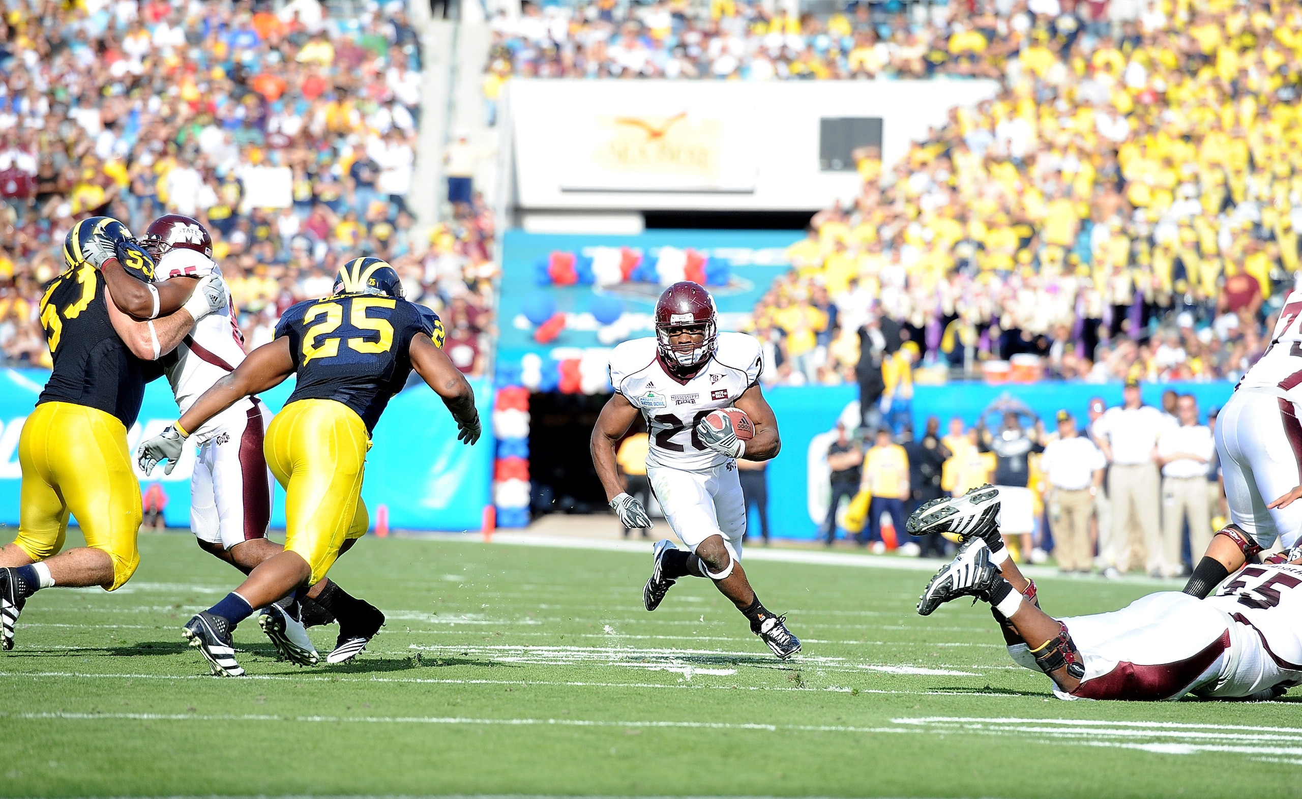 JACKSONVILLE, FL - JANUARY 01:  Running back Vick Ballard #28 of the Mississippi State Bulldogs rushes against the Michigan Wolverines during the Gator Bowl at EverBank Field on January 1, 2011 in Jacksonville, Florida  (Photo by Rick Dole/Getty Images)