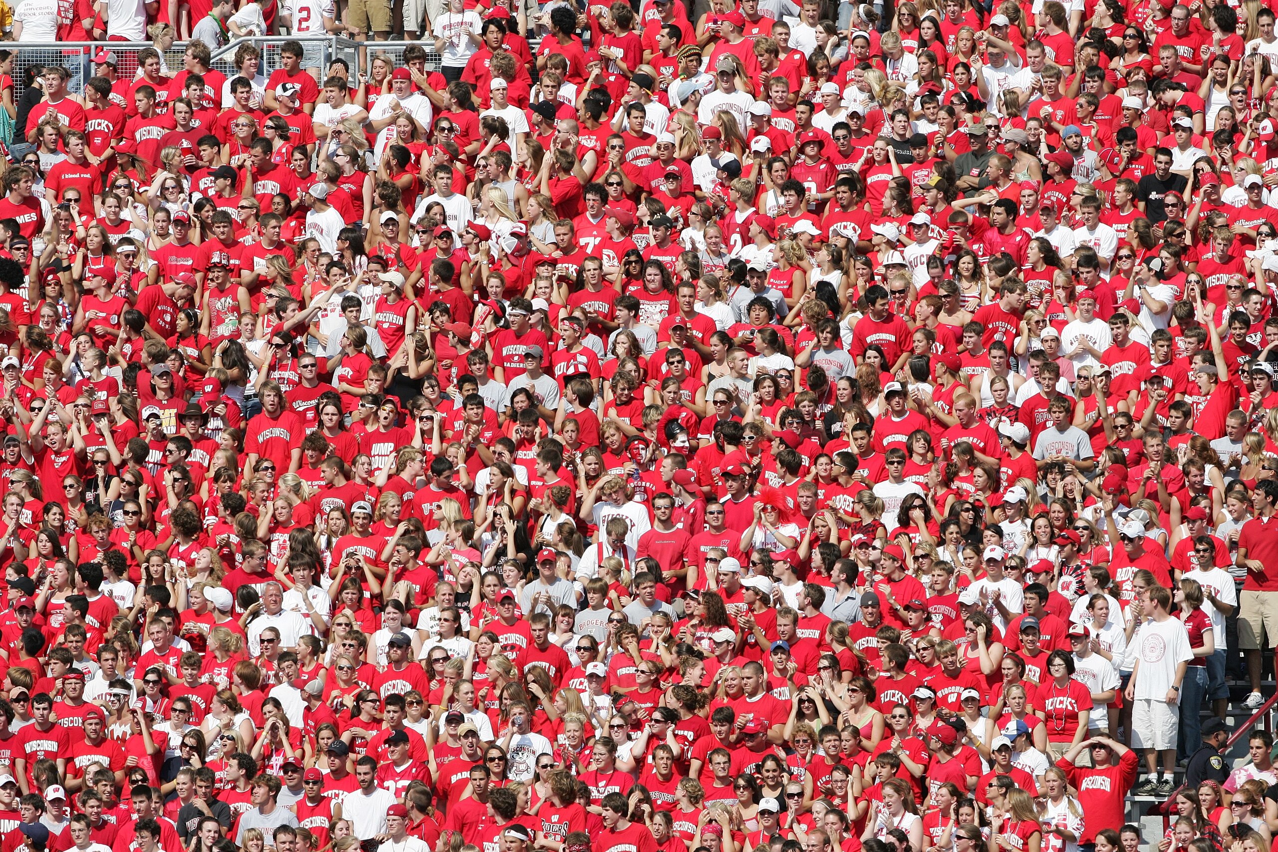 MADISON, WI - SEPTEMBER 16:  Wisconsin Badgers fans cheer during the game against the San Diego State Aztecs at Camp Randall Stadium on September 16, 2006  in Madison, Wisconsin. The Badgers defeated the Aztecs 14-0.  (Photo by Elsa/Getty Images)