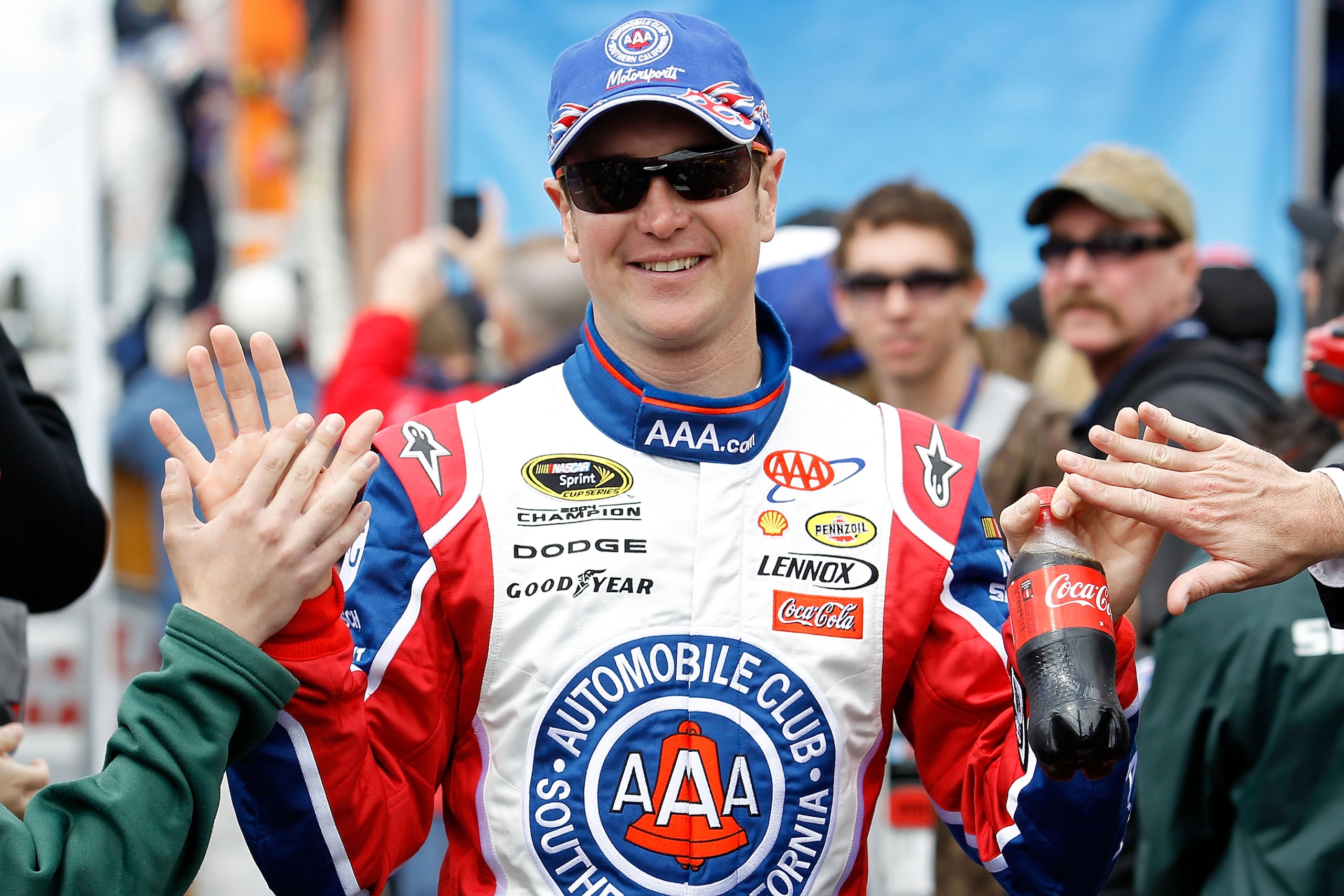FONTANA, CA - MARCH 27: Kurt Busch, driver of the #22 Southern California AAA Dodge, greets fans during driver introductions for the NASCAR Sprint Cup Series Auto Club 400 at Auto Club Speedway on March 27, 2011 in Fontana, California. (Photo by Todd Wa FONTANA, CA - MARCH 27: Kurt Busch, driver of the #22 Southern California AAA Dodge, greets fans during driver introductions for the NASCAR Sprint Cup Series Auto Club 400 at Auto Club Speedway on March 27, 2011 in Fontana, California. (Photo by Todd Wa